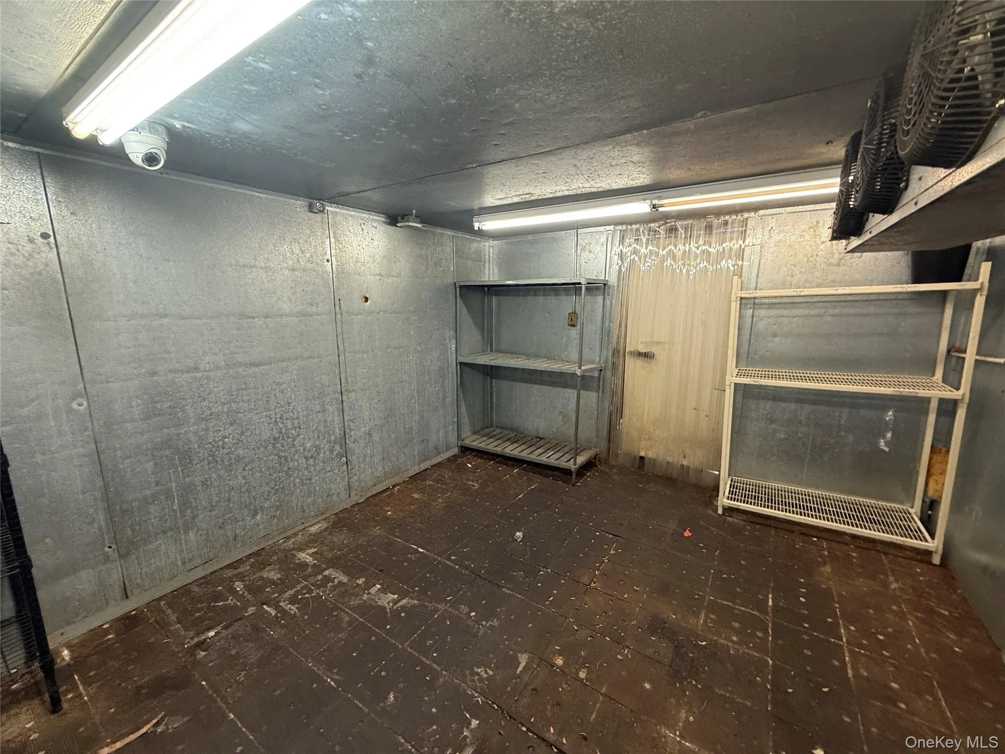 Basement featuring a heating unit and dark floors Basement featuring a heating unit and dark floors