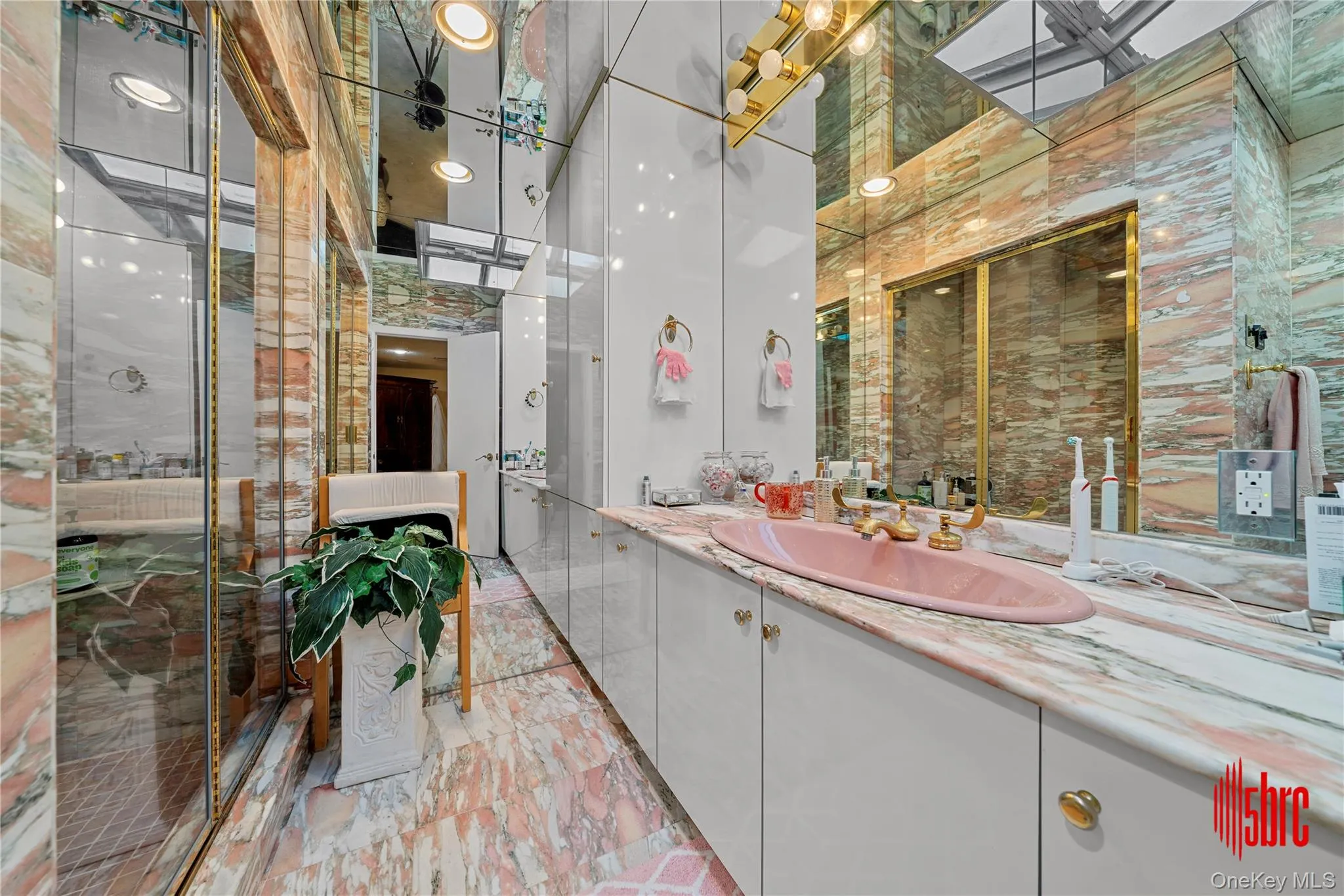 Bathroom with vanity and a shower stall Bathroom with vanity and a shower stall