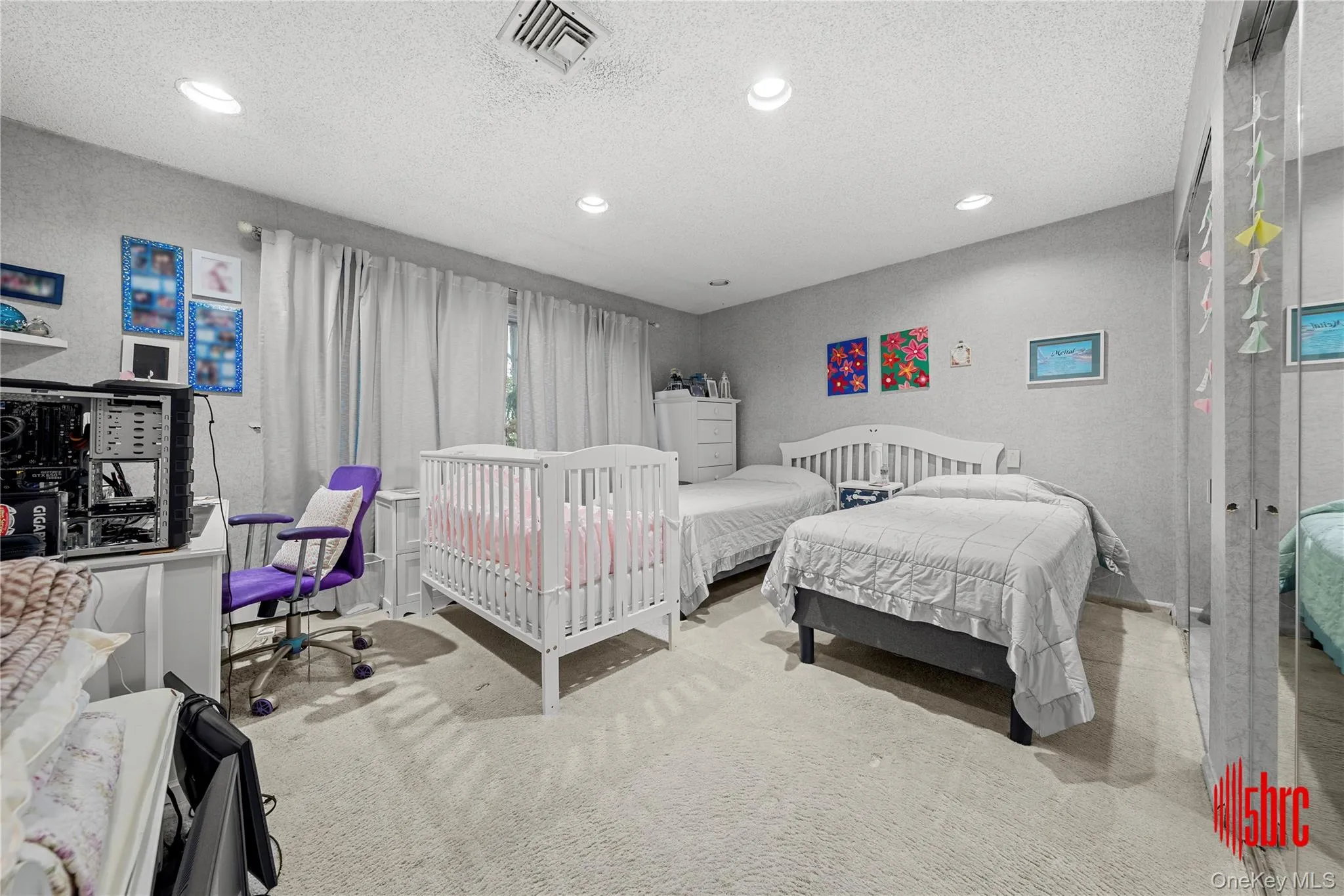 Carpeted bedroom featuring a textured ceiling and recessed lighting Carpeted bedroom featuring a textured ceiling and recessed lighting