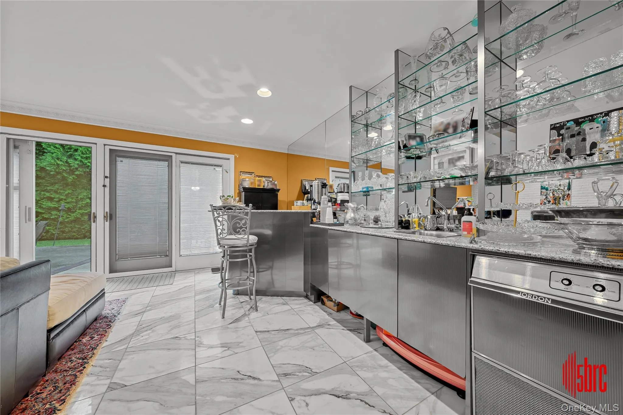 Indoor wet bar featuring open shelves, ornamental molding, dishwasher, light stone counters, and recessed lighting Indoor wet bar featuring open shelves, ornamental molding, dishwasher, light stone counters, and recessed lighting