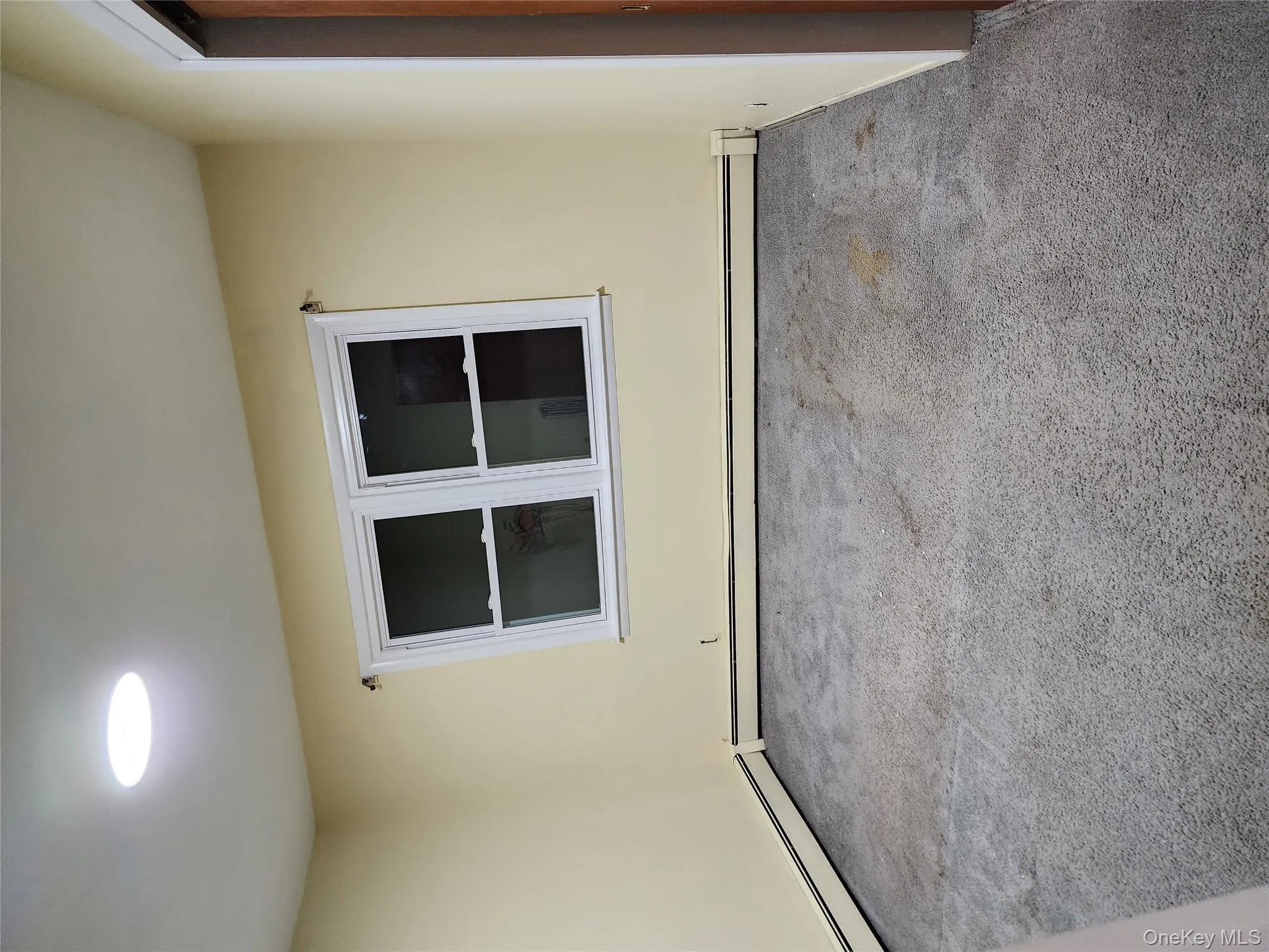 Unfurnished room with carpet floors, baseboard heating, and recessed lighting Unfurnished room with carpet floors, baseboard heating, and recessed lighting