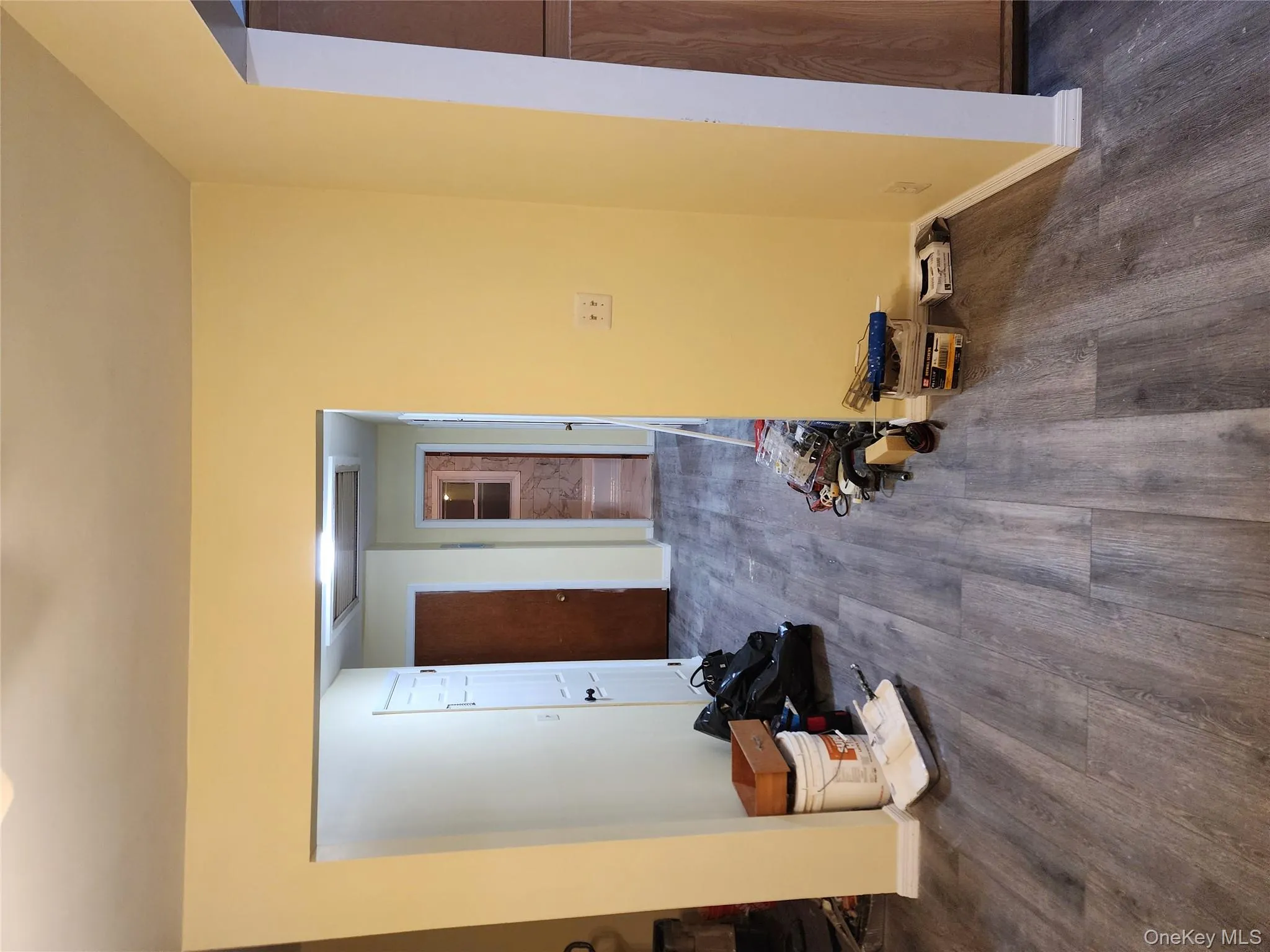 Empty room with dark wood finished floors and baseboards Empty room with dark wood finished floors and baseboards