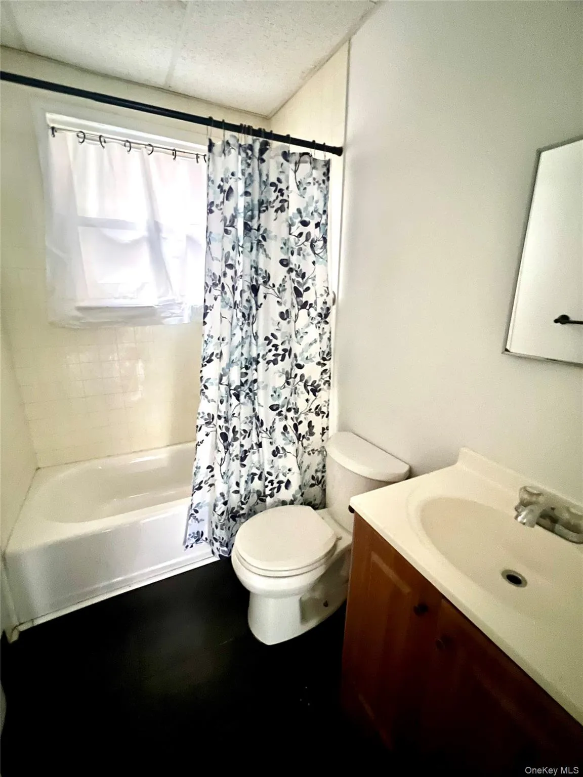 Full bath with vanity and shower / tub combo with curtain Full bath with vanity and shower / tub combo with curtain