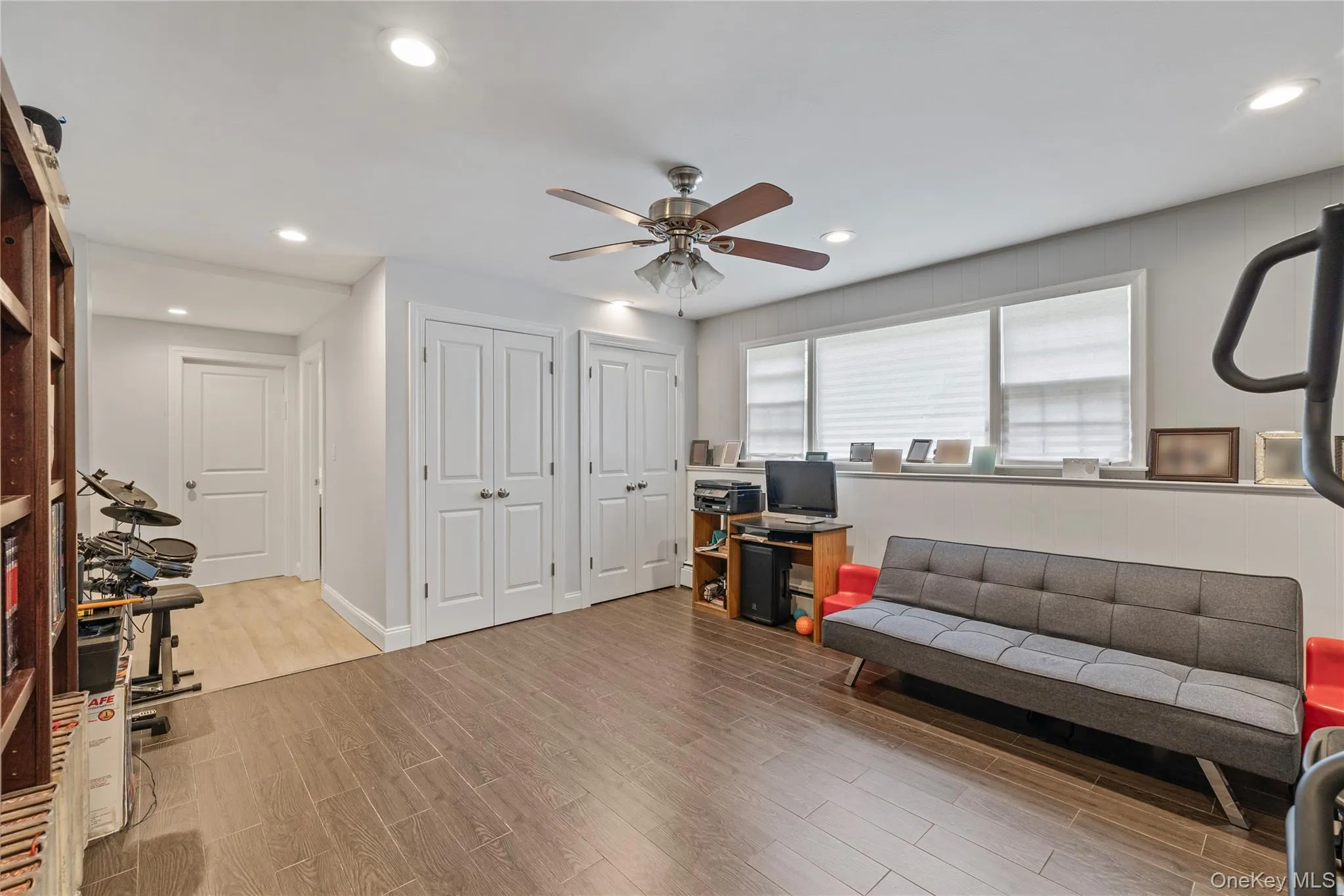 Home office featuring light wood-style floors, recessed lighting, and a ceiling fan Home office featuring light wood-style floors, recessed lighting, and a ceiling fan