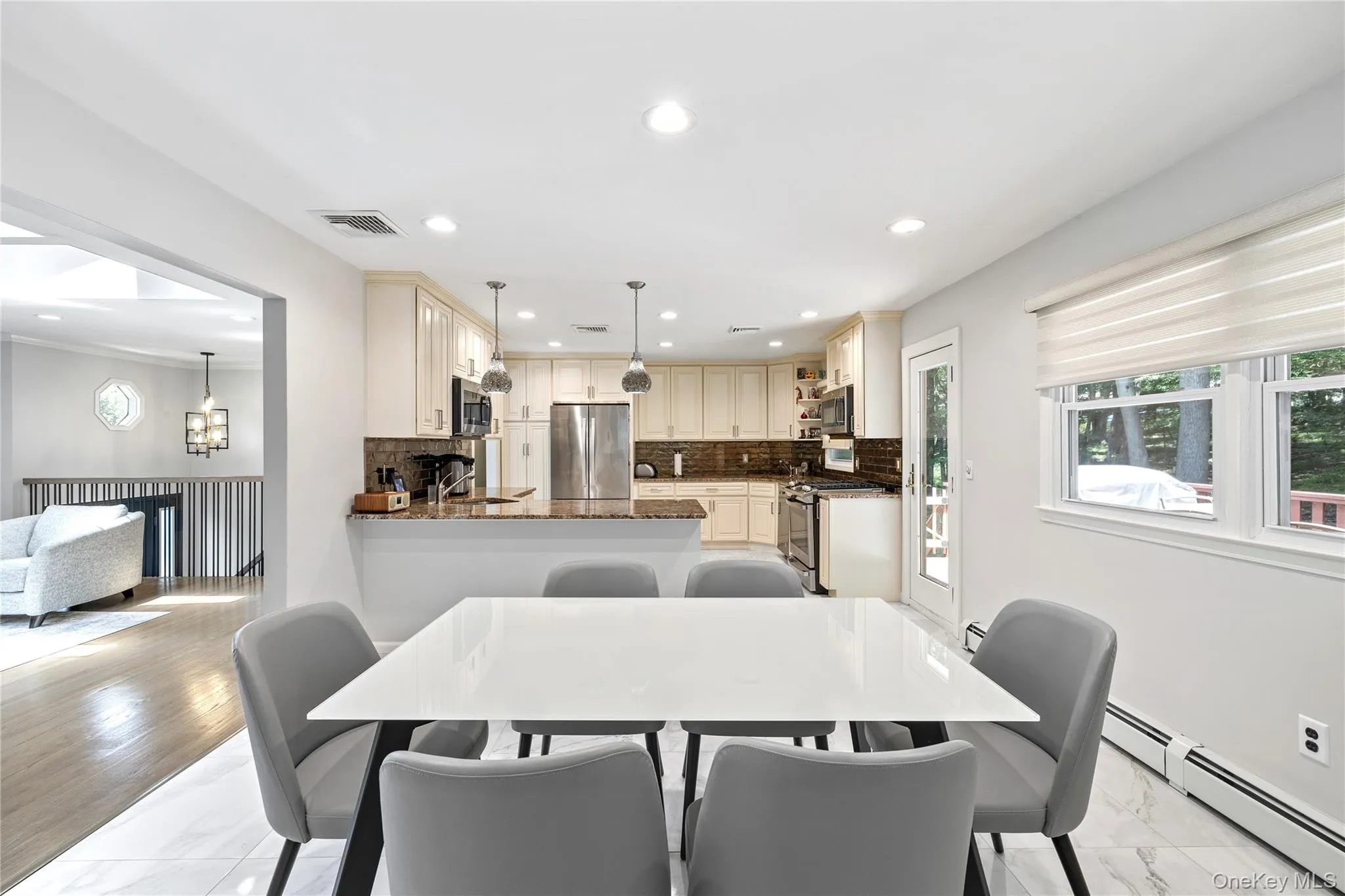 Dining area with baseboard heating and recessed lighting Dining area with baseboard heating and recessed lighting