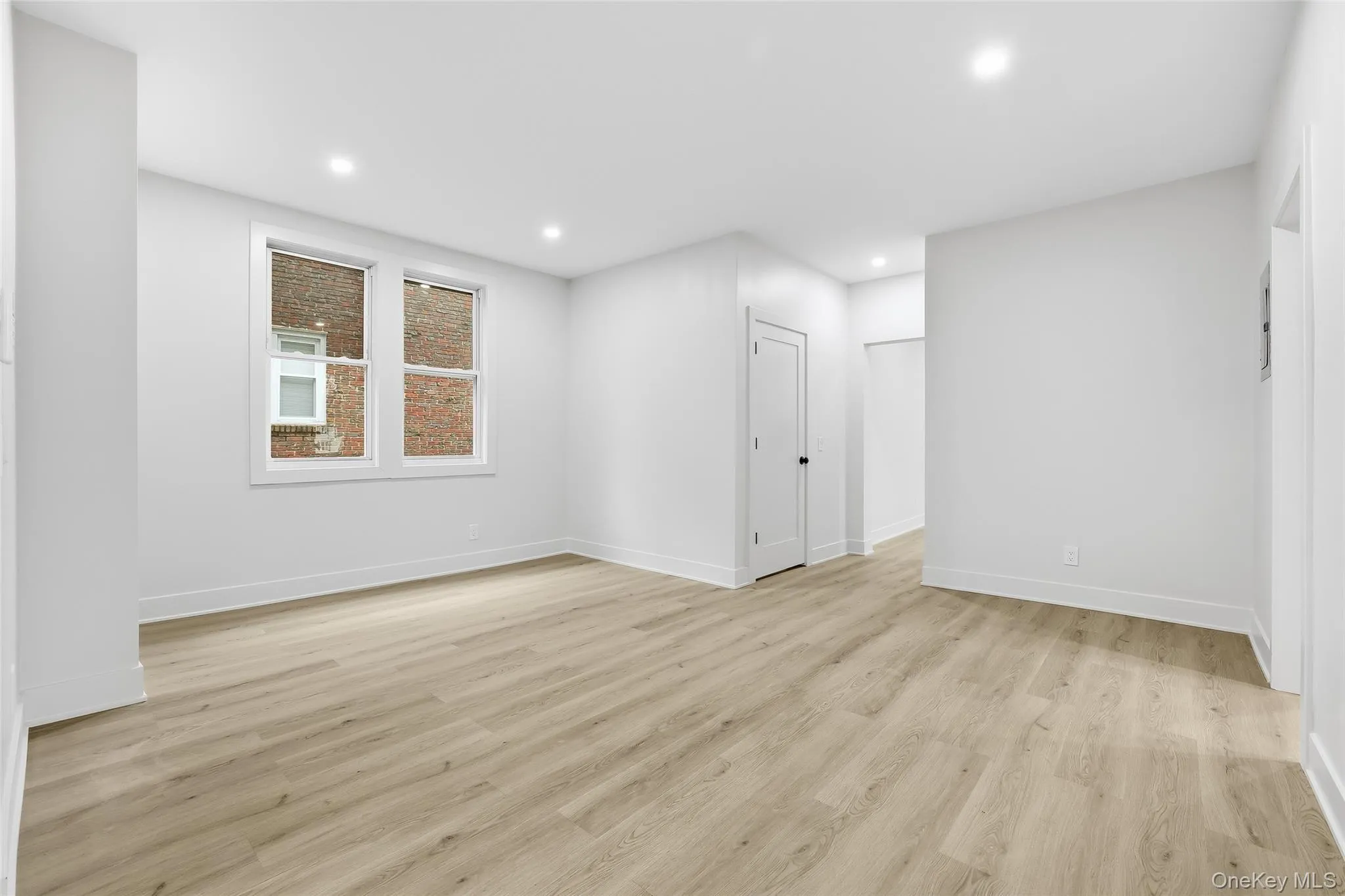 Unfurnished room with light wood-type flooring and recessed lighting Unfurnished room with light wood-type flooring and recessed lighting