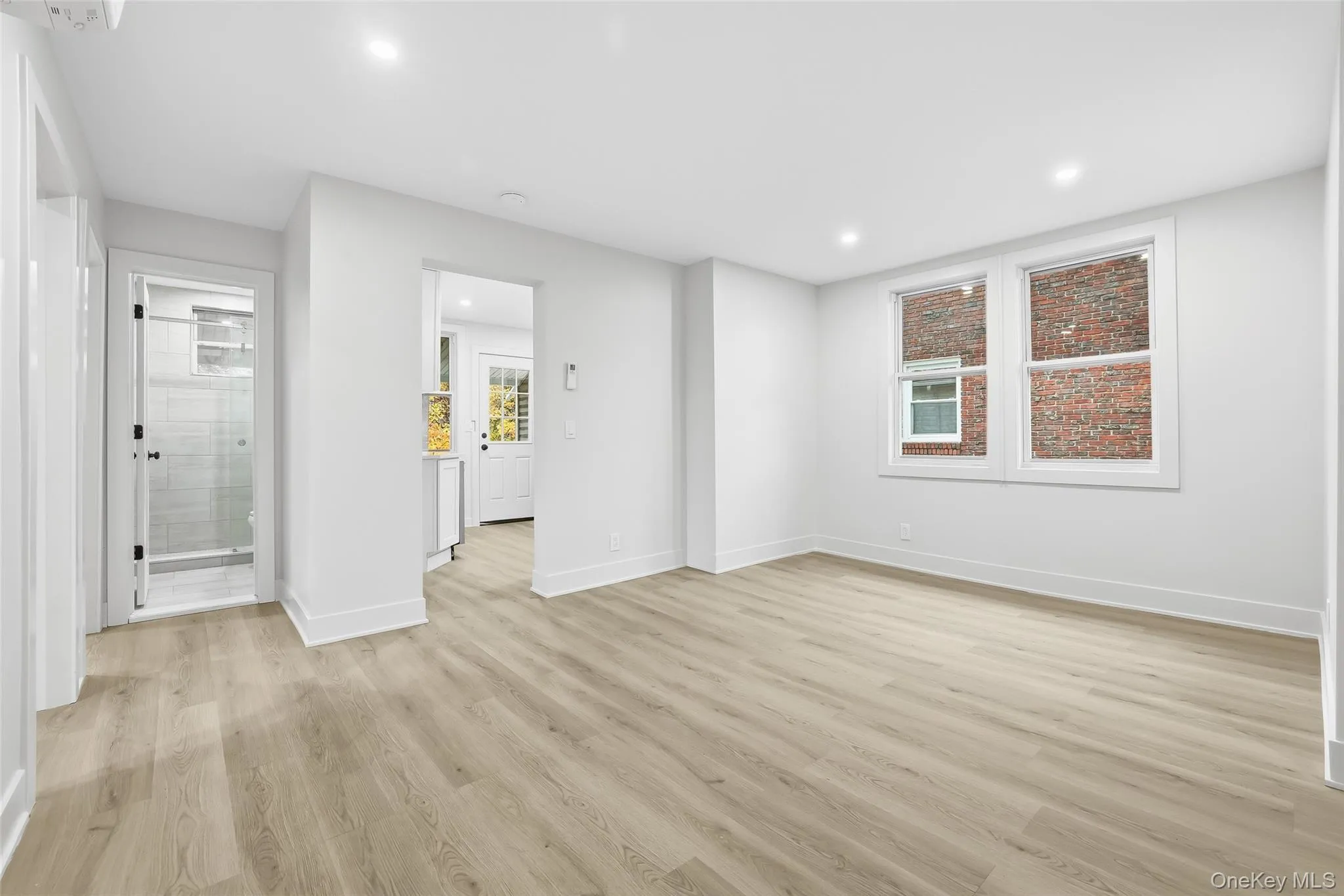 Unfurnished room with light wood-style flooring and recessed lighting Unfurnished room with light wood-style flooring and recessed lighting