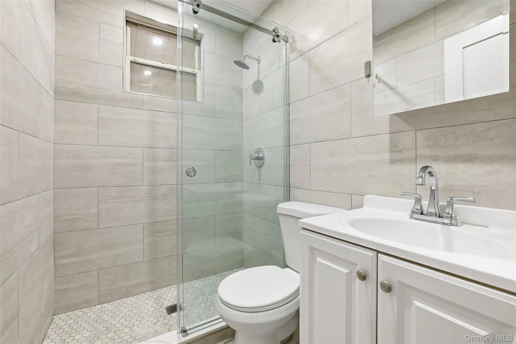 Full bathroom with vanity and a shower stall Full bathroom with vanity and a shower stall