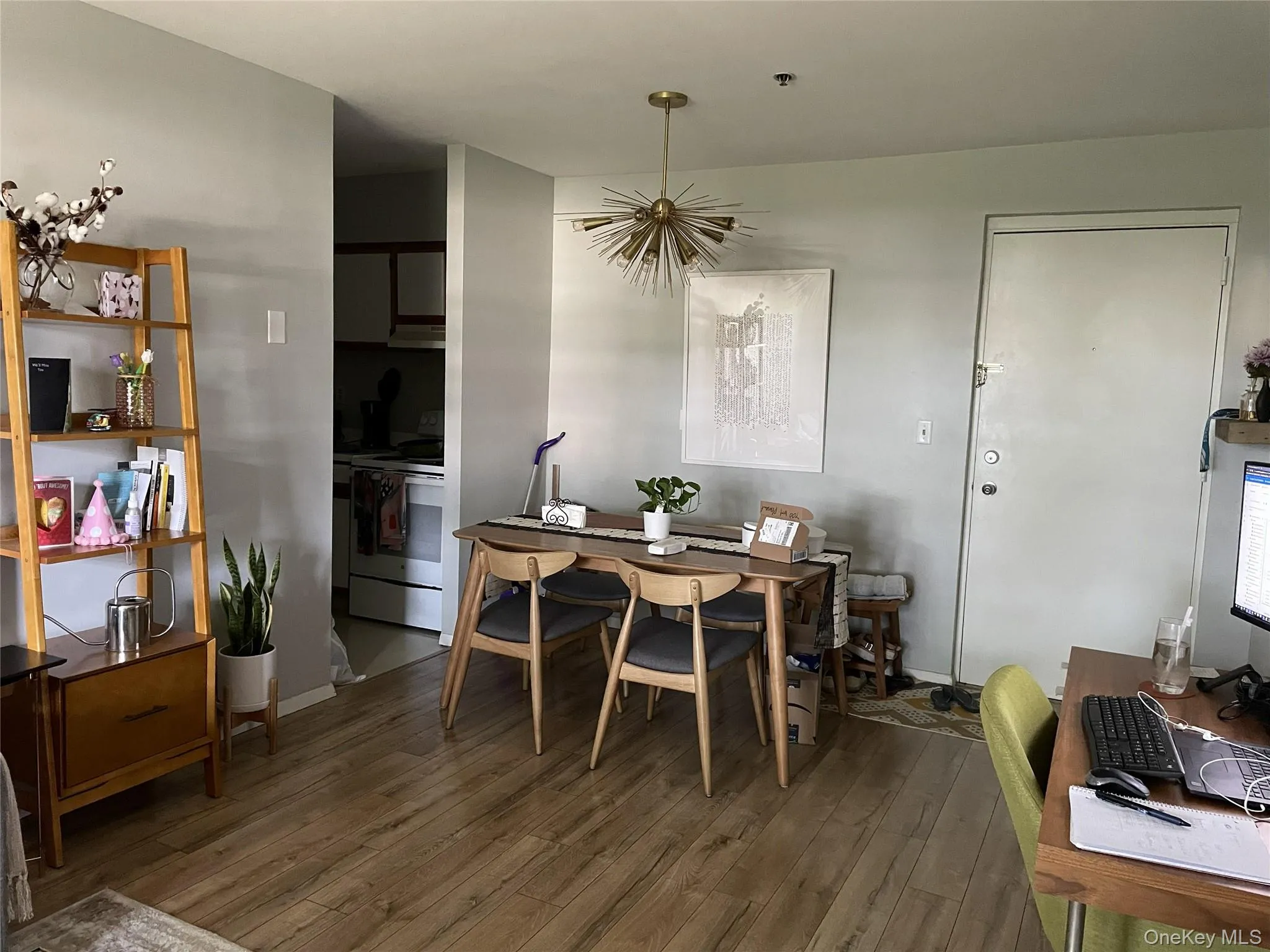 Dining space with hardwood / wood-style flooring and a chandelier Dining space with hardwood / wood-style flooring and a chandelier
