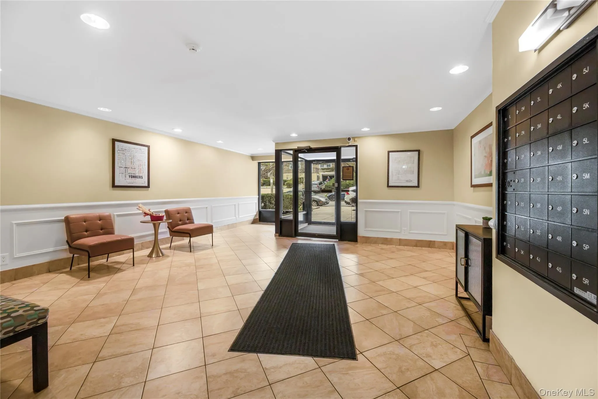 Common area with a wainscoted wall, recessed lighting, and a decorative wall Common area with a wainscoted wall, recessed lighting, and a decorative wall