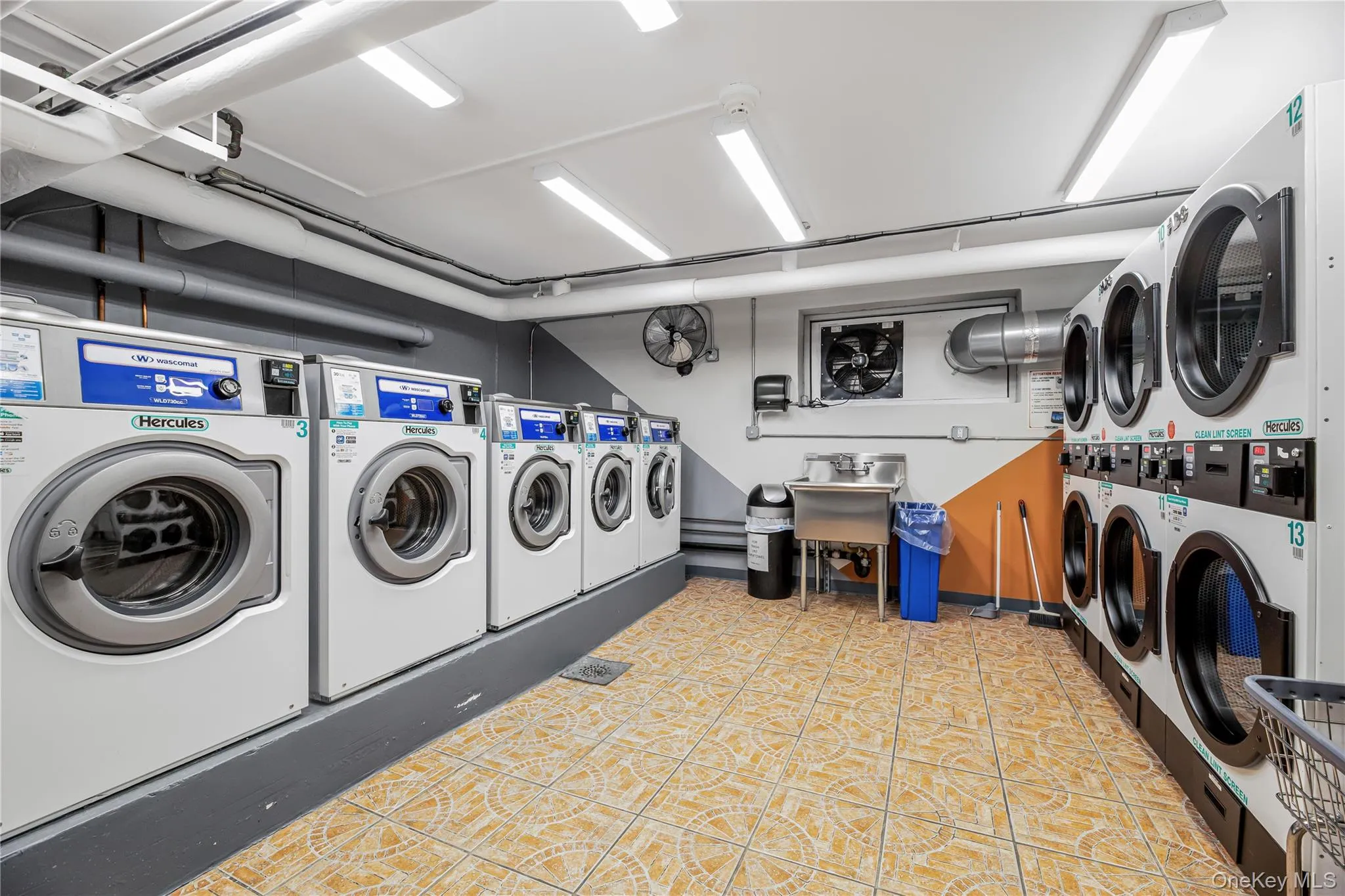 Shared laundry featuring independent washer and dryer Shared laundry featuring independent washer and dryer
