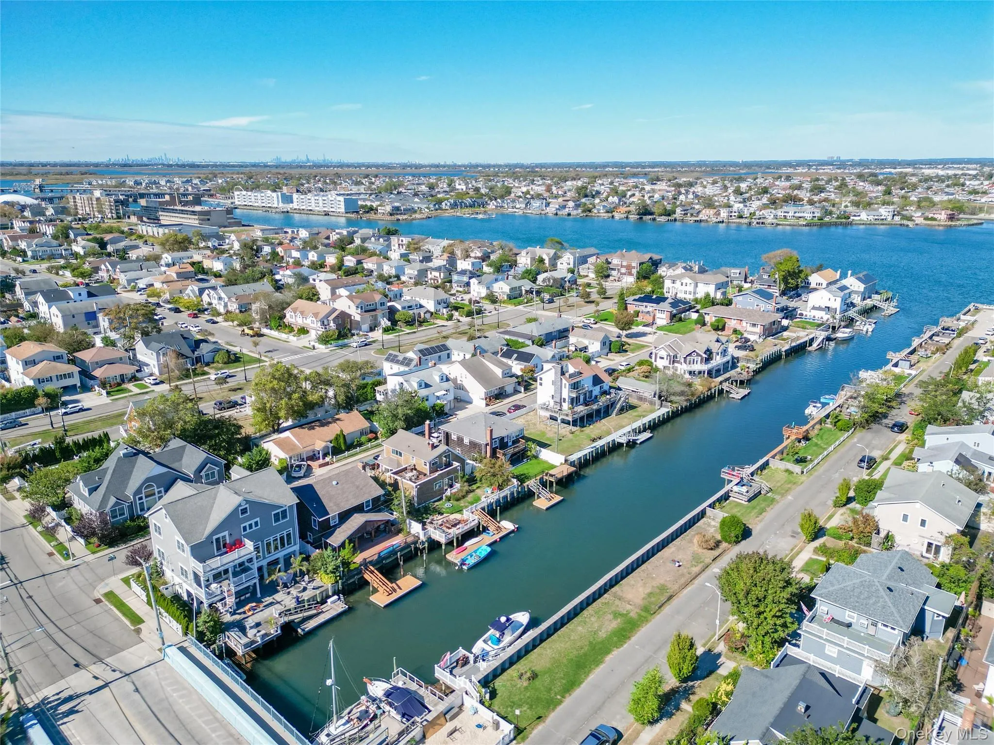 Aerial view of residential area featuring a nearby body of water Aerial view of residential area featuring a nearby body of water