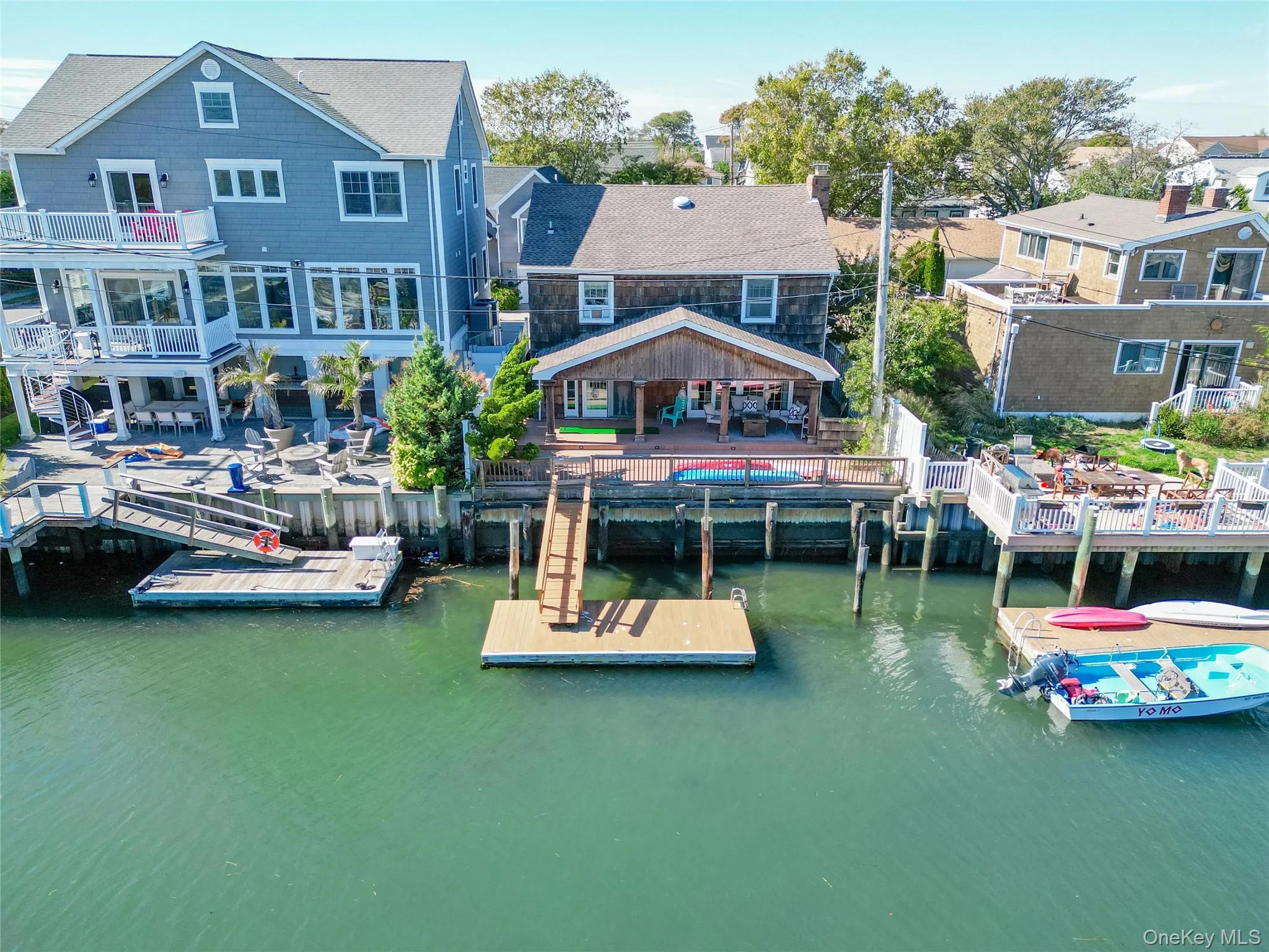 Dock featuring a water view and a residential view Dock featuring a water view and a residential view