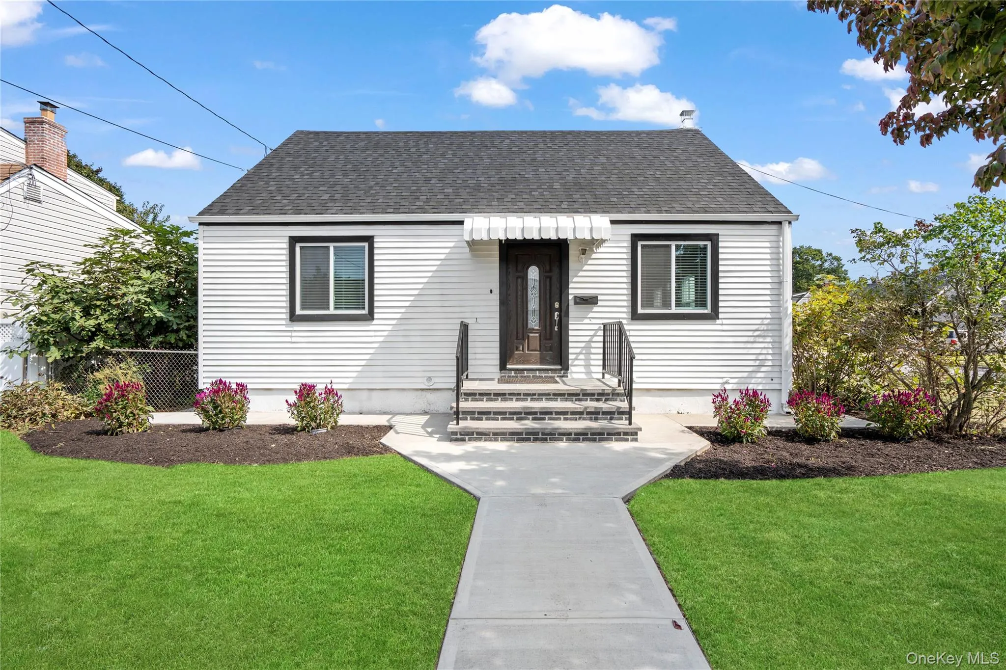 Bungalow-style home with a shingled roof Bungalow-style home with a shingled roof