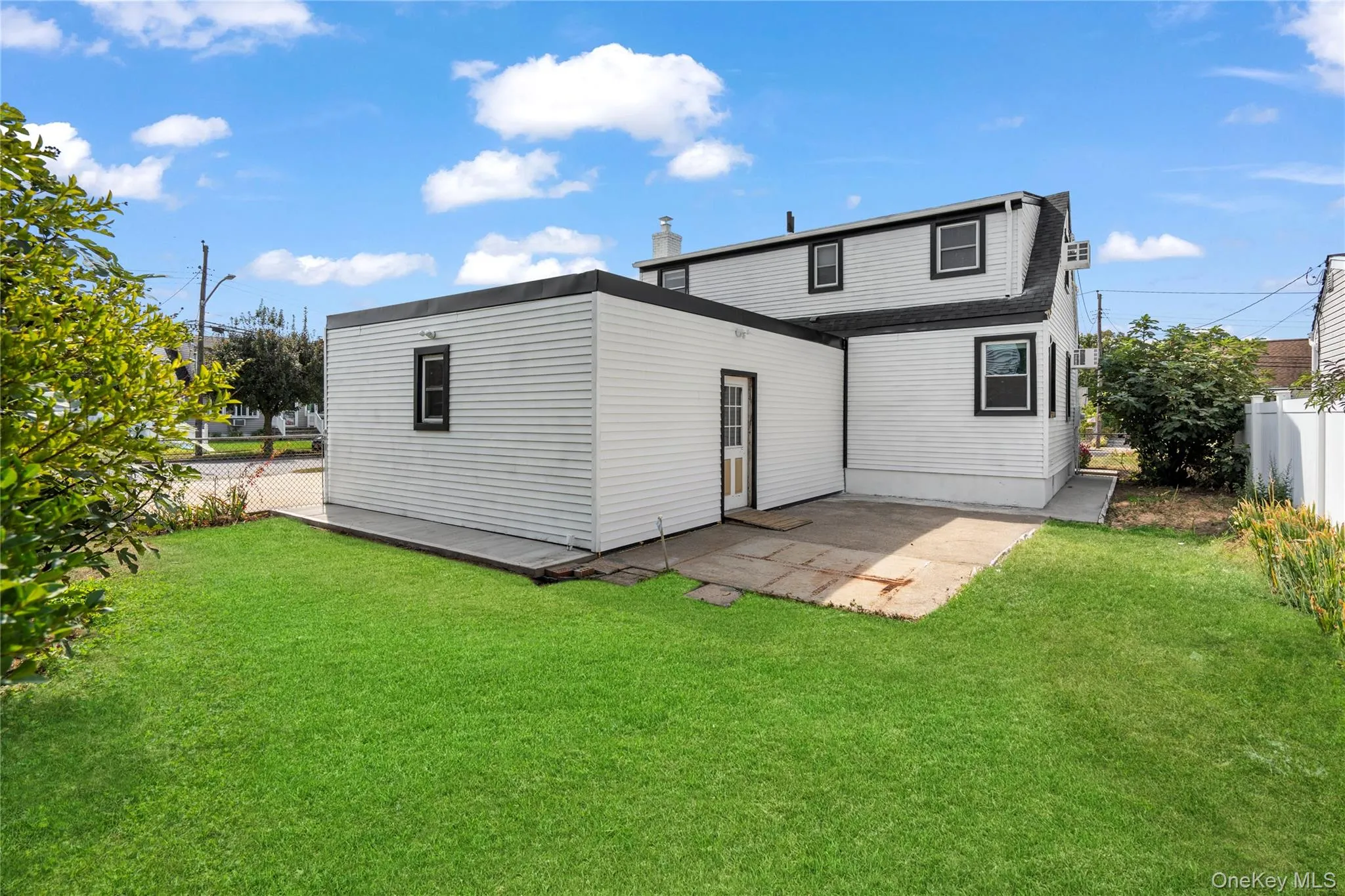 Back of house featuring a patio area Back of house featuring a patio area