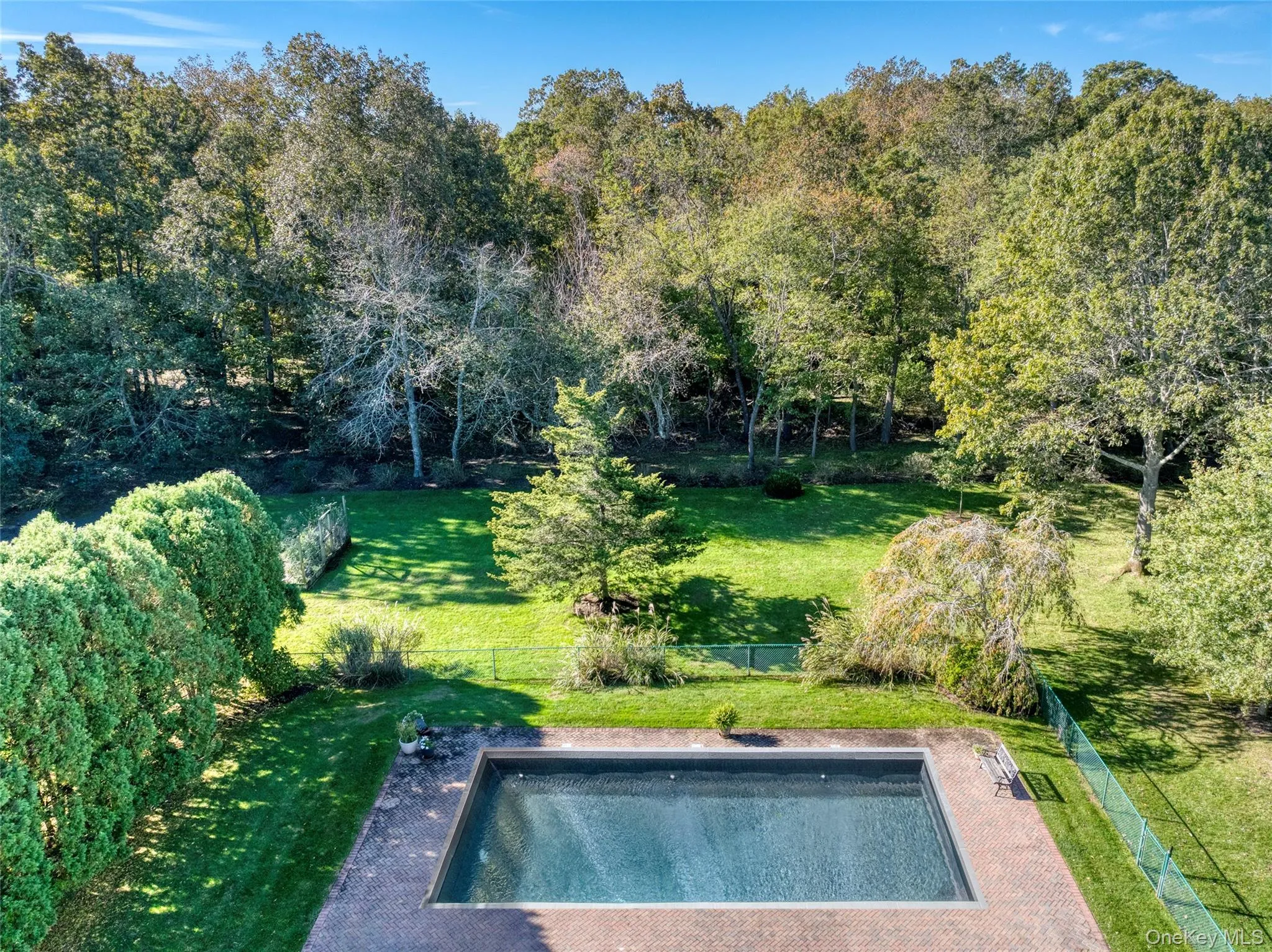 View of swimming pool featuring a fenced backyard View of swimming pool featuring a fenced backyard