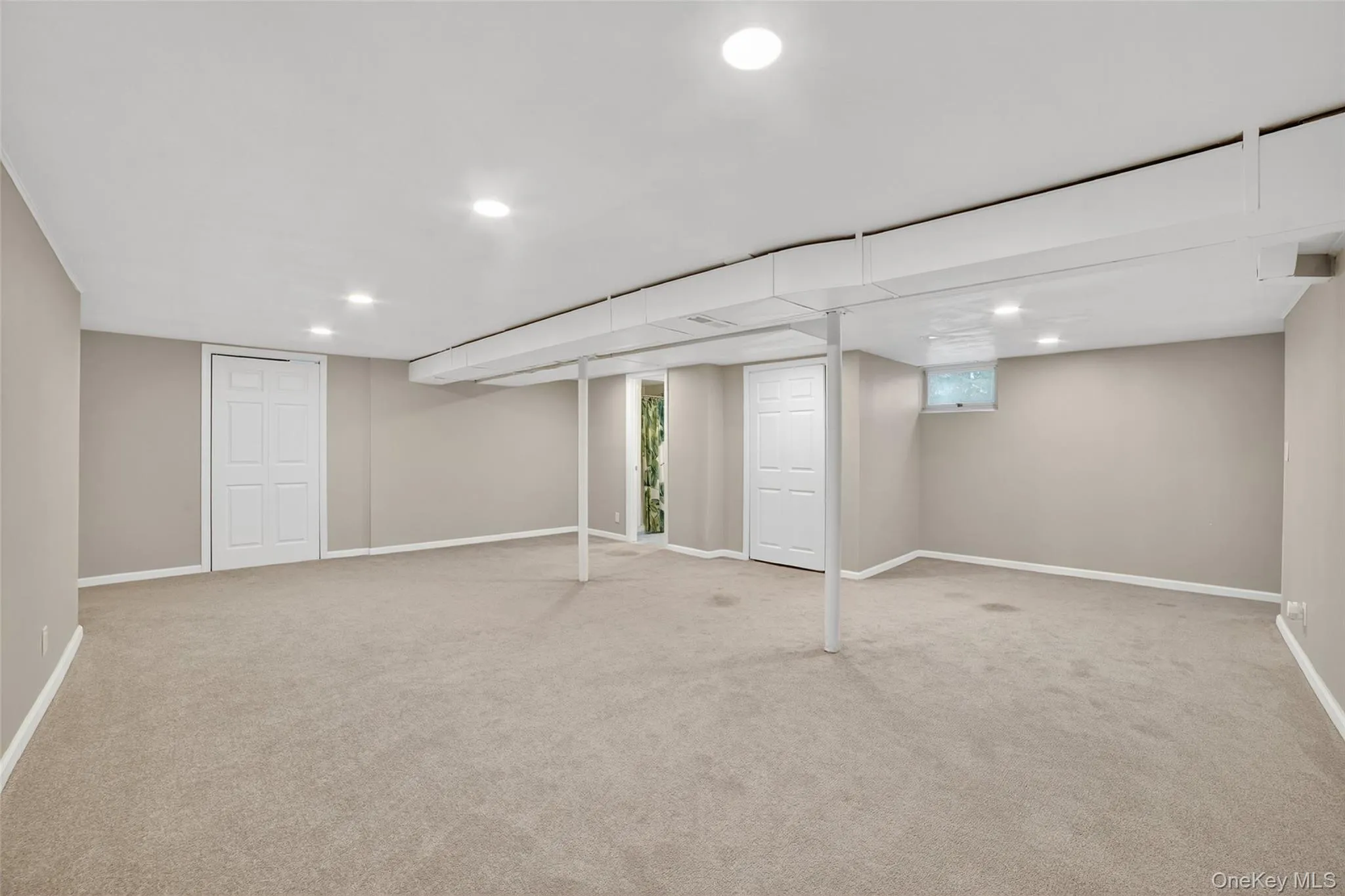 Basement with light carpet and recessed lighting Basement with light carpet and recessed lighting