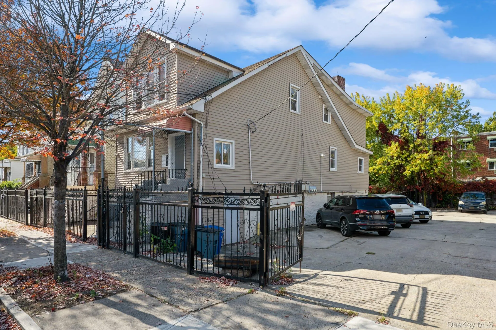 View of front facade featuring a fenced front yard and a chimney View of front facade featuring a fenced front yard and a chimney