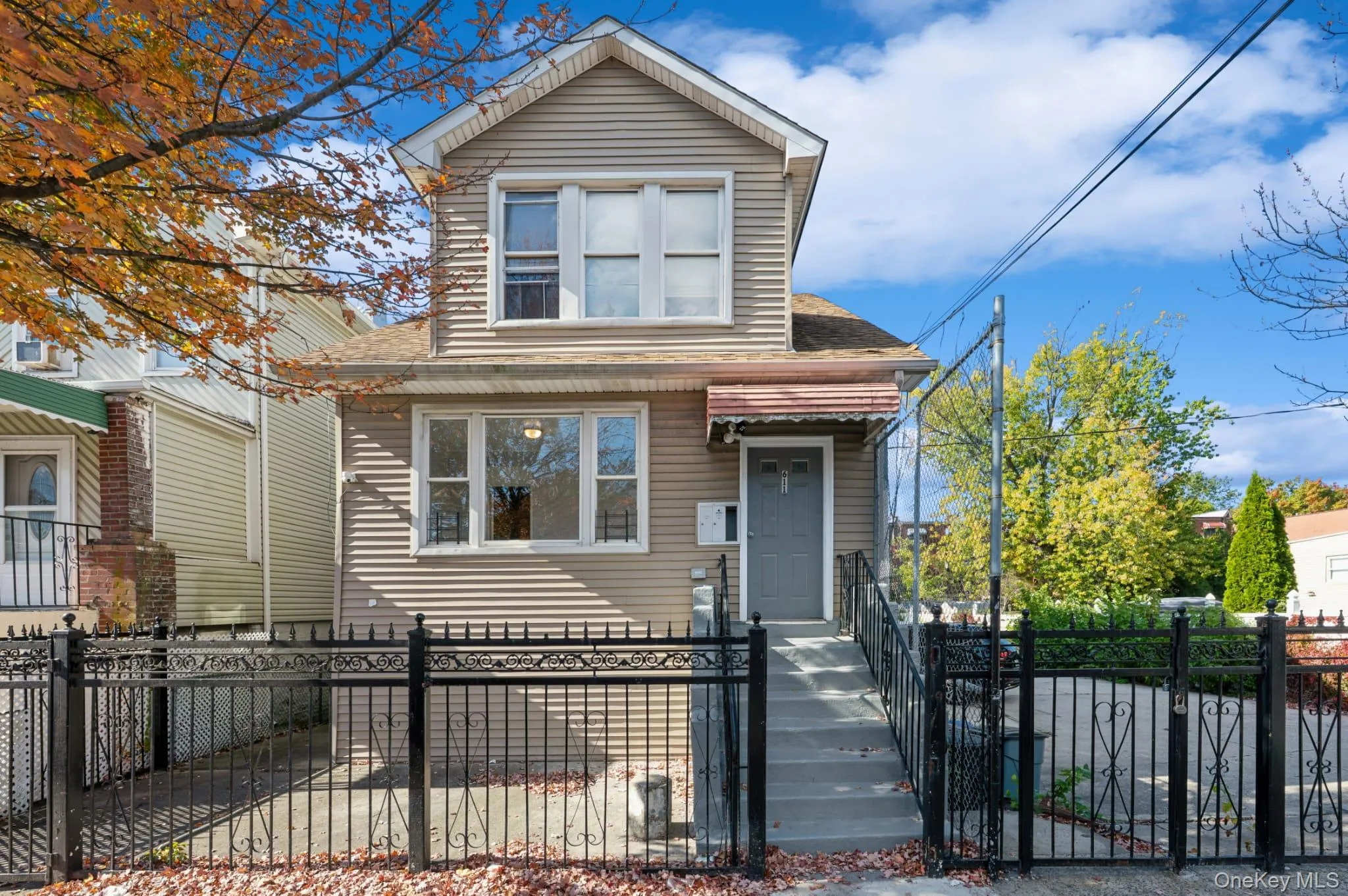 View of front facade with roof with shingles, a fenced front yard, and a gate View of front facade with roof with shingles, a fenced front yard, and a gate