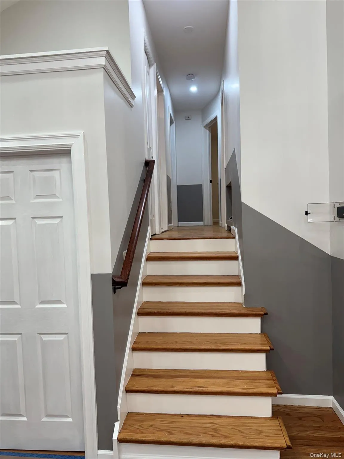 Stairs with wood finished floors and baseboards Stairs with wood finished floors and baseboards