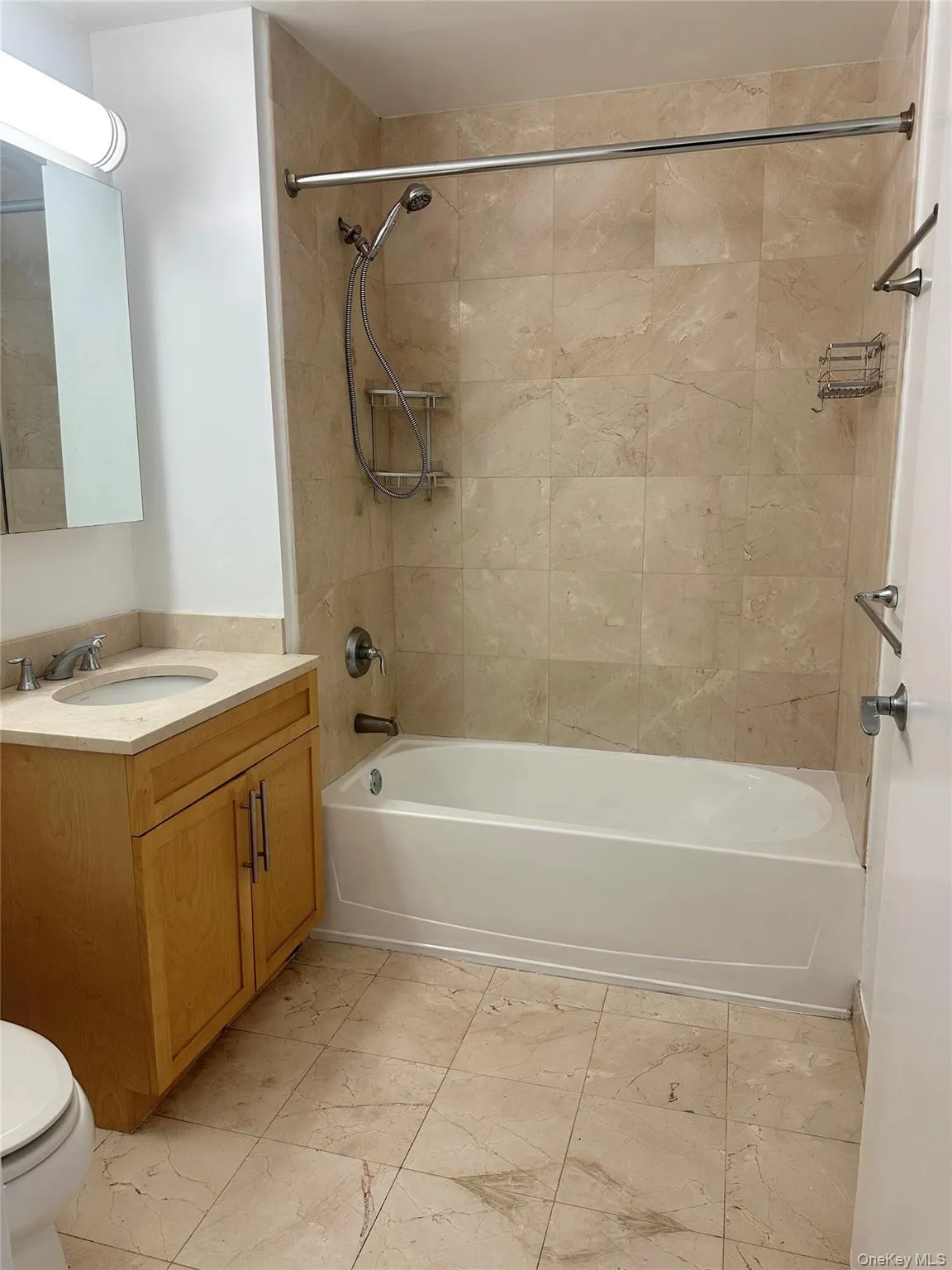 Bathroom with vanity and washtub / shower combination Bathroom with vanity and washtub / shower combination