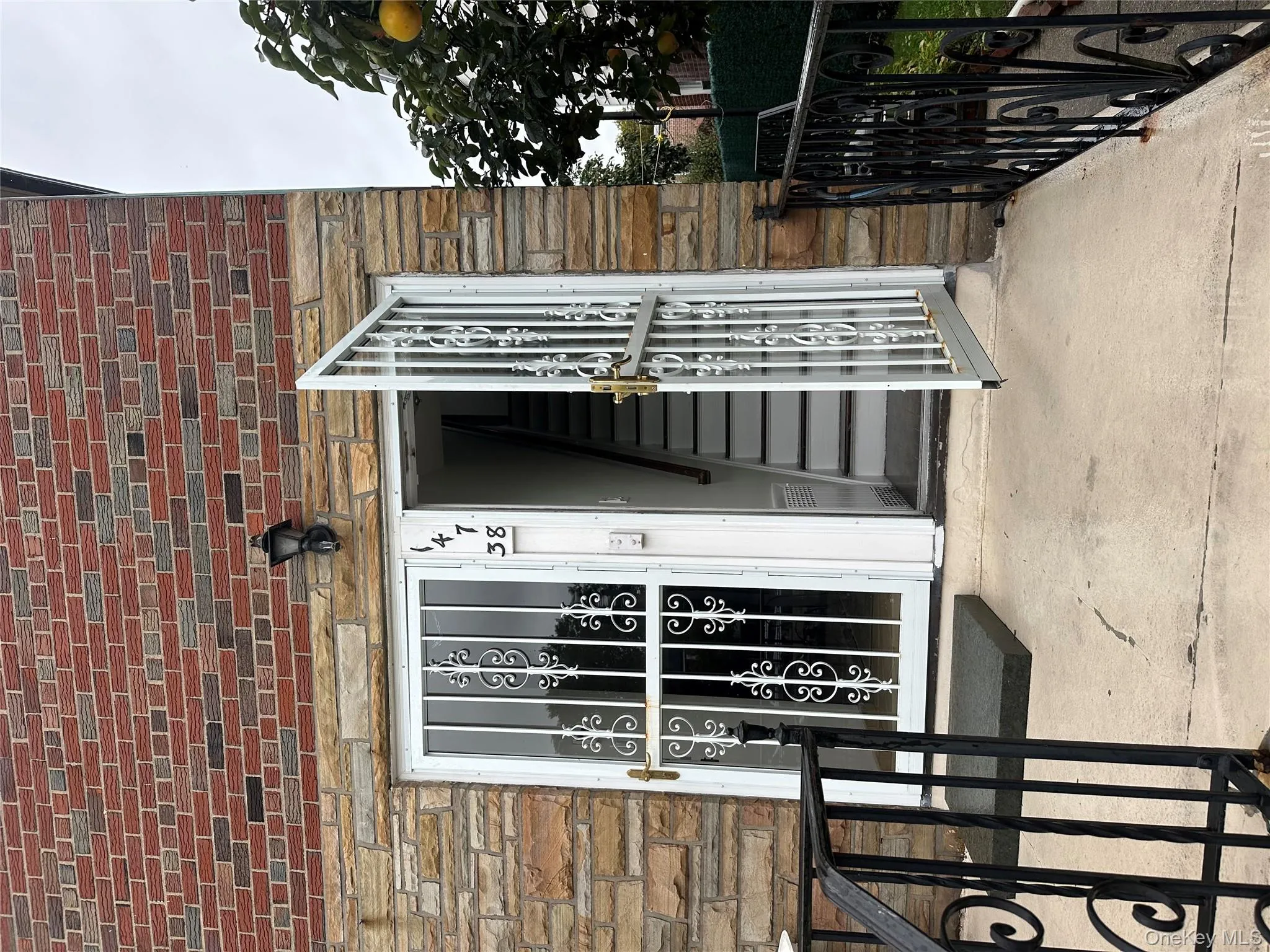 View of exterior entry featuring stone siding View of exterior entry featuring stone siding
