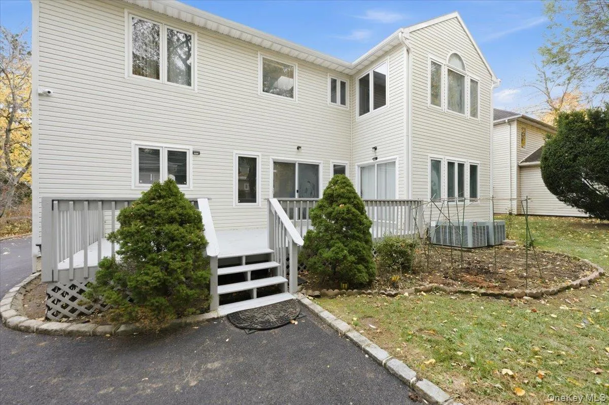 Rear view of property featuring a wooden deck Rear view of property featuring a wooden deck