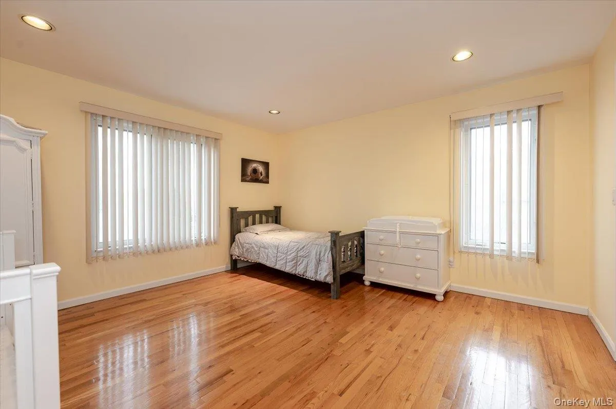 Bedroom featuring recessed lighting and light wood-style floors Bedroom featuring recessed lighting and light wood-style floors