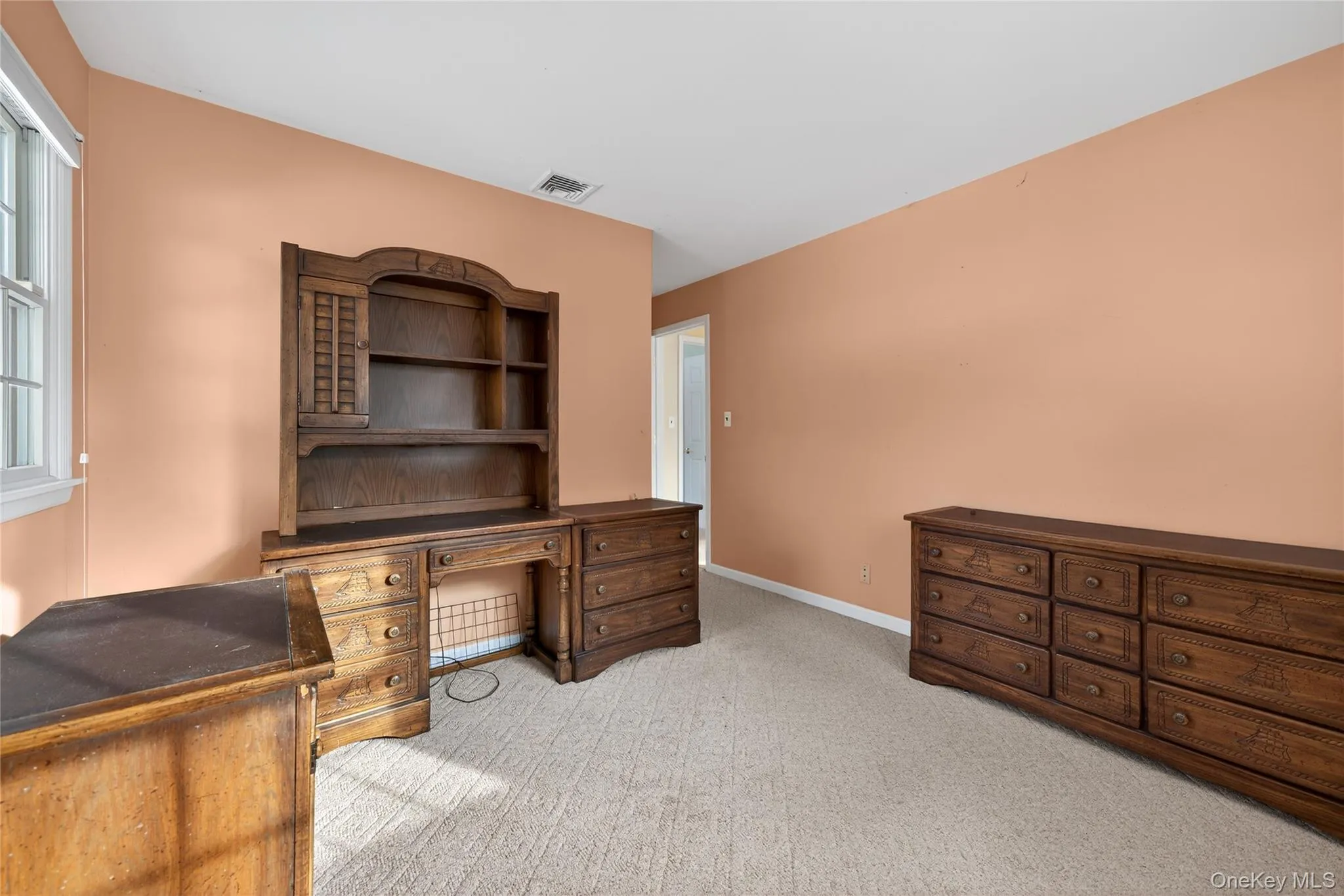 Office area featuring light carpet and baseboards Office area featuring light carpet and baseboards
