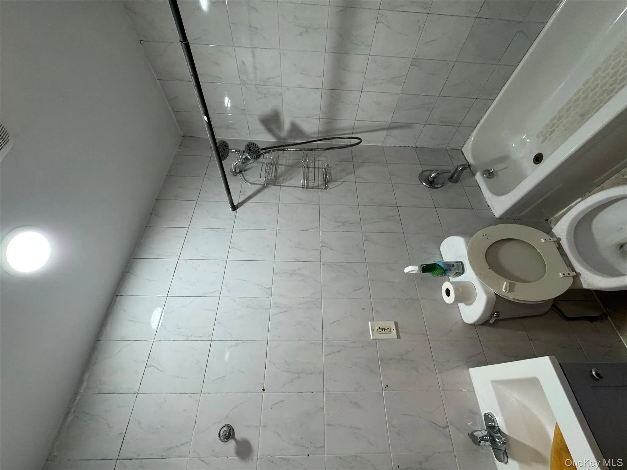 Full bath featuring tile walls, bathing tub / shower combination, and vanity Full bath featuring tile walls, bathing tub / shower combination, and vanity