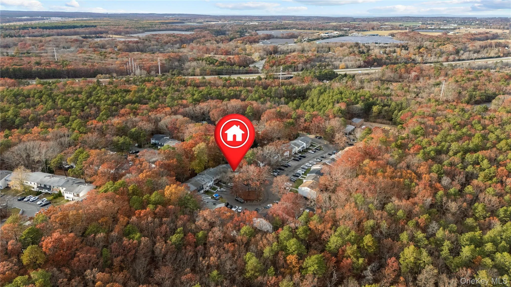 Aerial overview of property's location featuring a heavily wooded area Aerial overview of property's location featuring a heavily wooded area