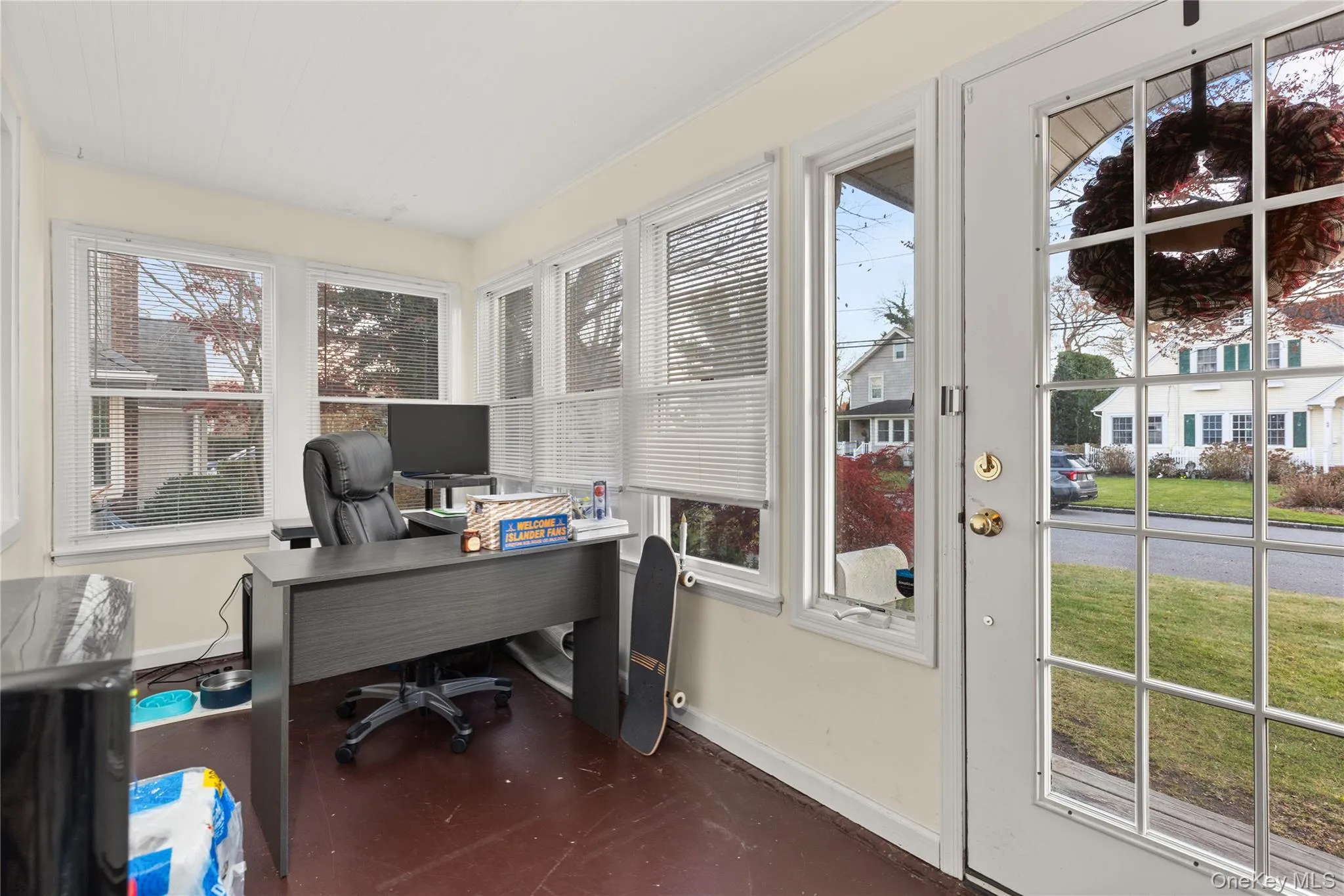 Home office featuring baseboards and finished concrete floors Home office featuring baseboards and finished concrete floors