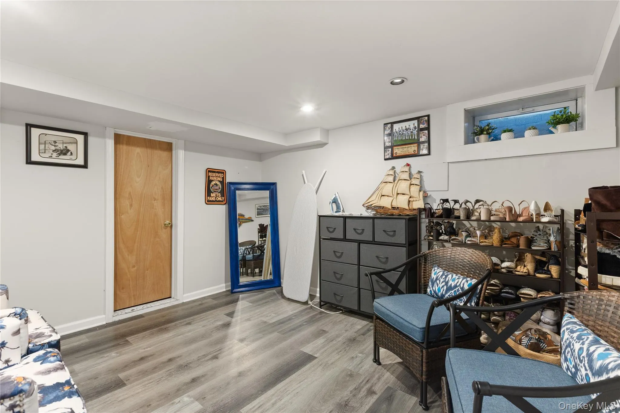 Sitting room with wood finished floors and recessed lighting Sitting room with wood finished floors and recessed lighting
