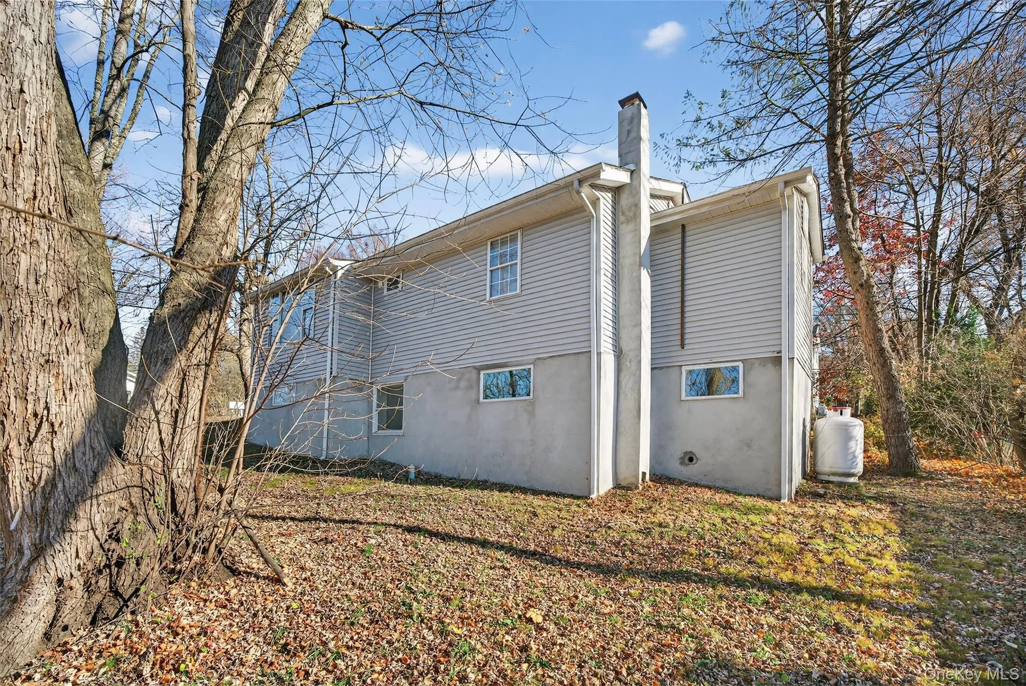 Rear view of property with a chimney Rear view of property with a chimney