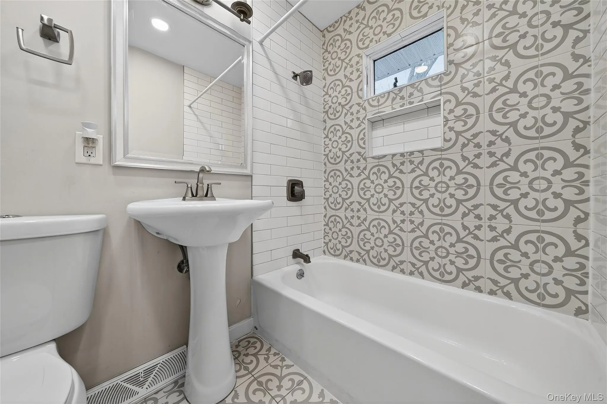 Full bath featuring shower / washtub combination and tile patterned floors Full bath featuring shower / washtub combination and tile patterned floors
