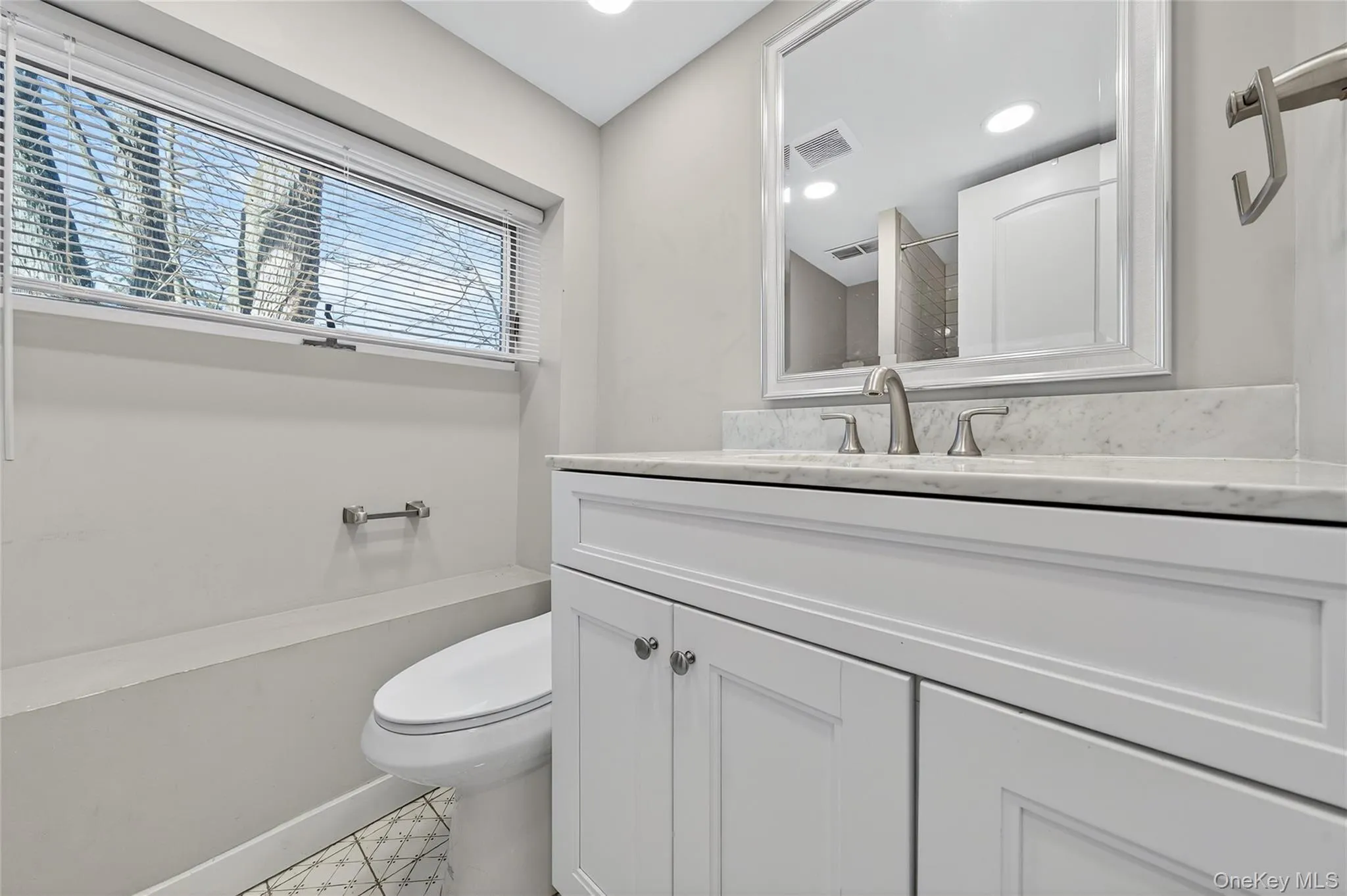 Bathroom with vanity and recessed lighting Bathroom with vanity and recessed lighting