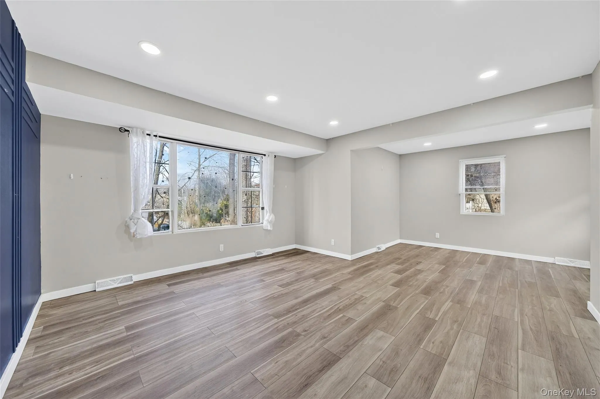 Spare room with recessed lighting, light wood finished floors, and healthy amount of natural light Spare room with recessed lighting, light wood finished floors, and healthy amount of natural light