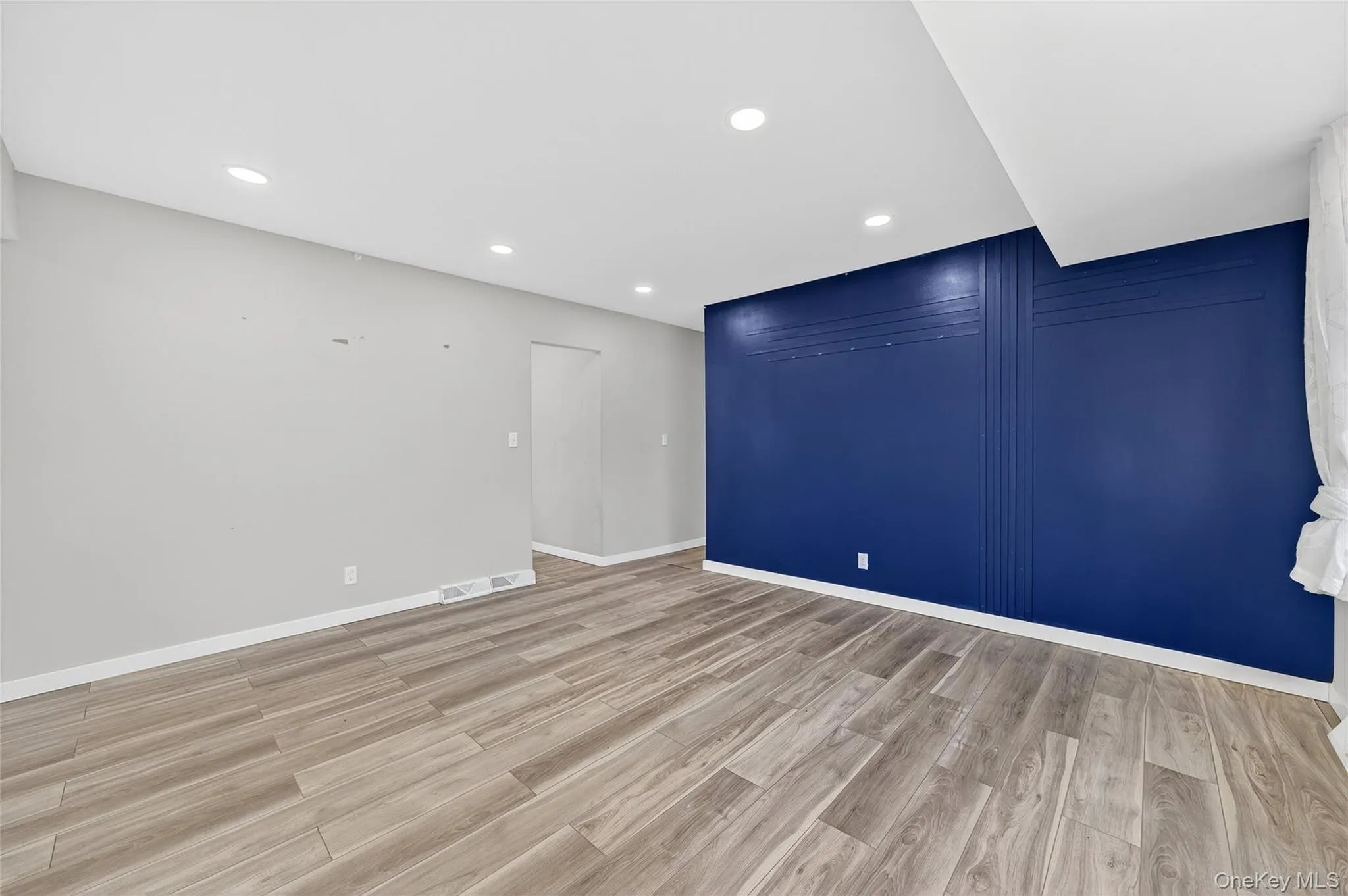 Empty room featuring recessed lighting and light wood-type flooring Empty room featuring recessed lighting and light wood-type flooring