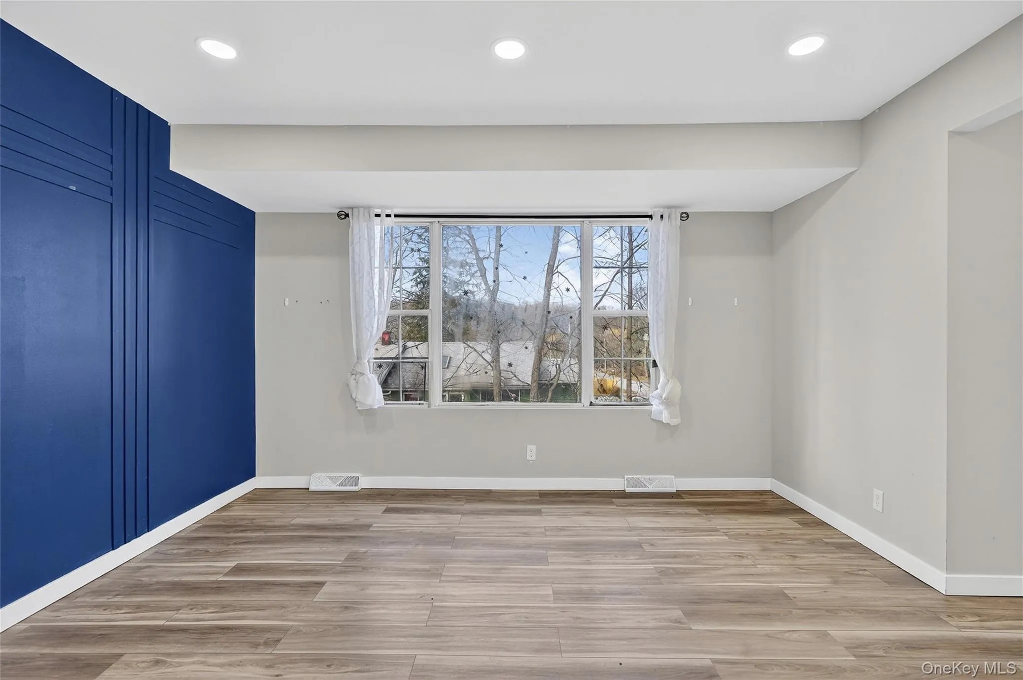 Spare room featuring light wood-style floors and recessed lighting Spare room featuring light wood-style floors and recessed lighting