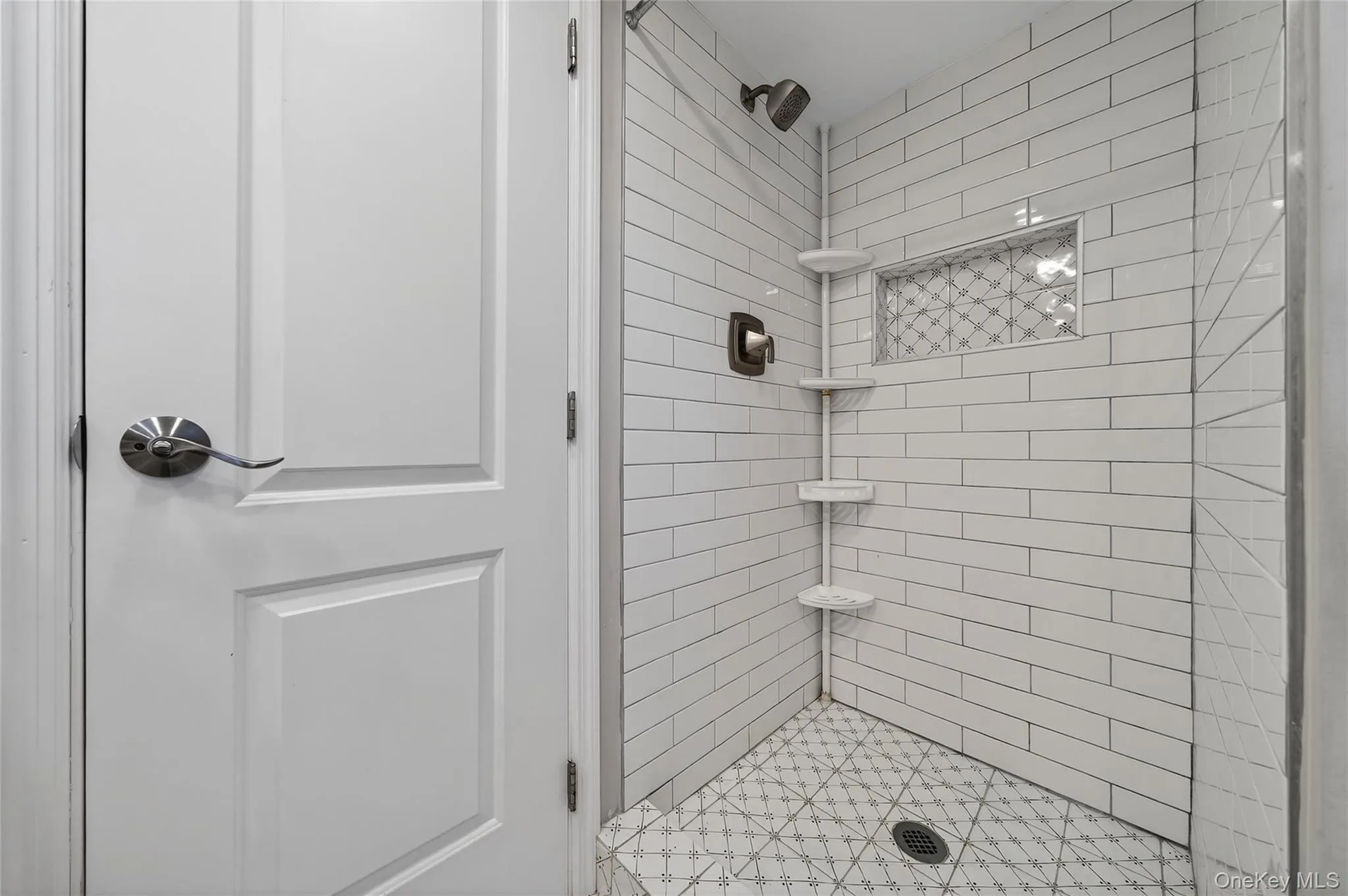 Bathroom featuring a shower stall Bathroom featuring a shower stall