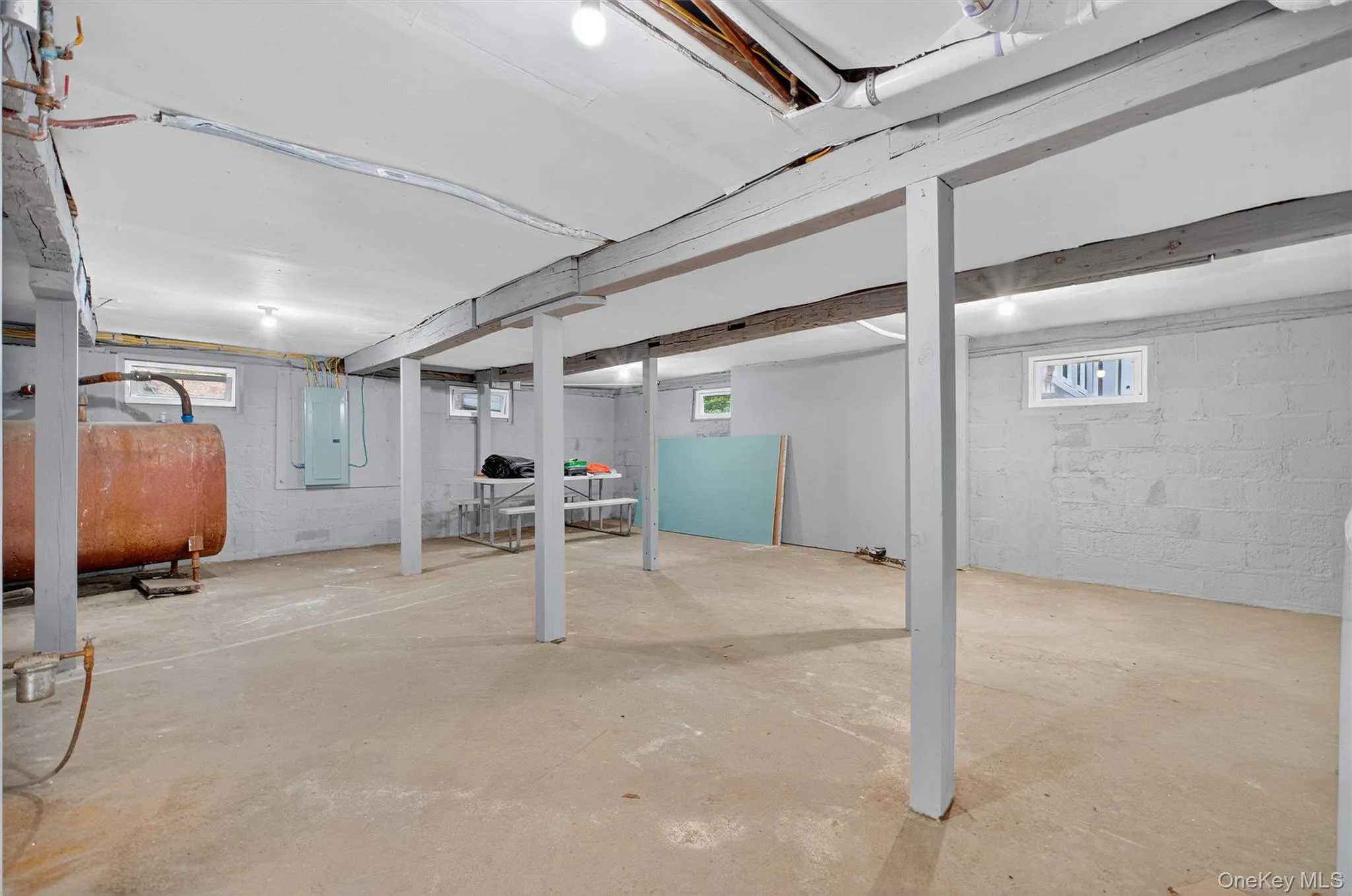 Basement with oil tank and electric panel Basement with oil tank and electric panel
