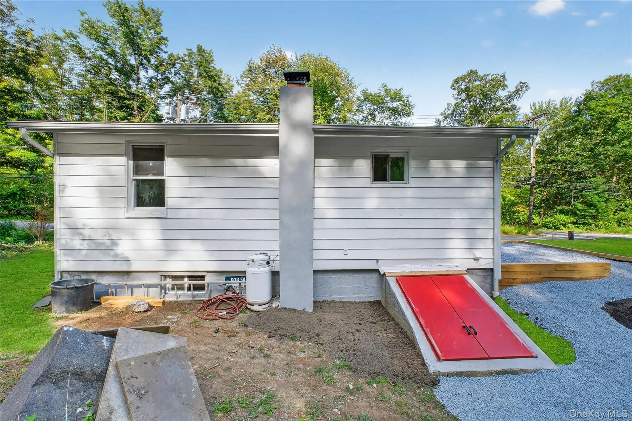 View of side of home with a chimney View of side of home with a chimney