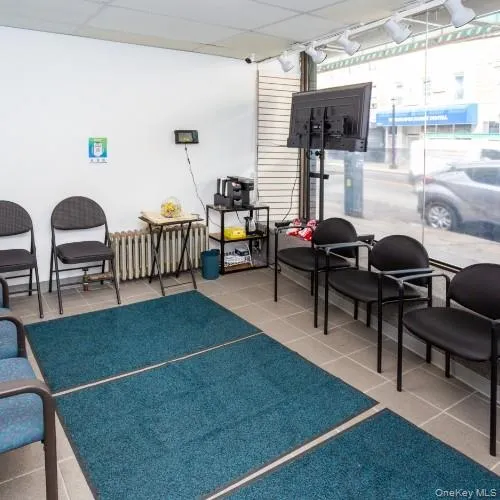 Building lobby featuring a drop ceiling Building lobby featuring a drop ceiling