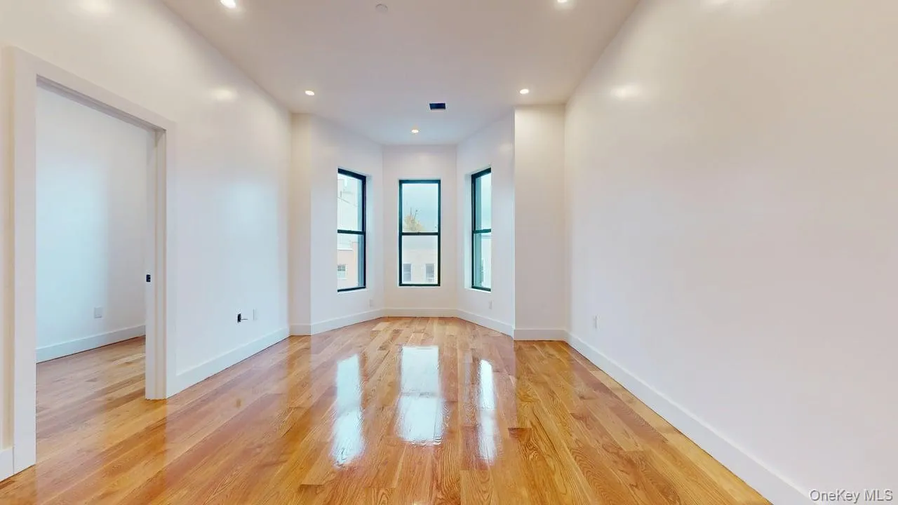 Empty room featuring light wood-style flooring and recessed lighting Empty room featuring light wood-style flooring and recessed lighting