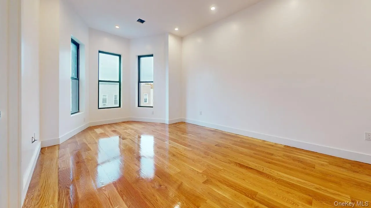 Unfurnished room featuring light wood-style floors and recessed lighting Unfurnished room featuring light wood-style floors and recessed lighting