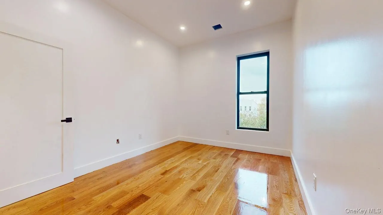 Unfurnished room with light wood-style floors and recessed lighting Unfurnished room with light wood-style floors and recessed lighting