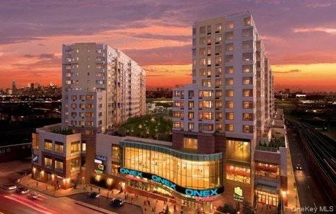 Property at dusk with a city view Property at dusk with a city view