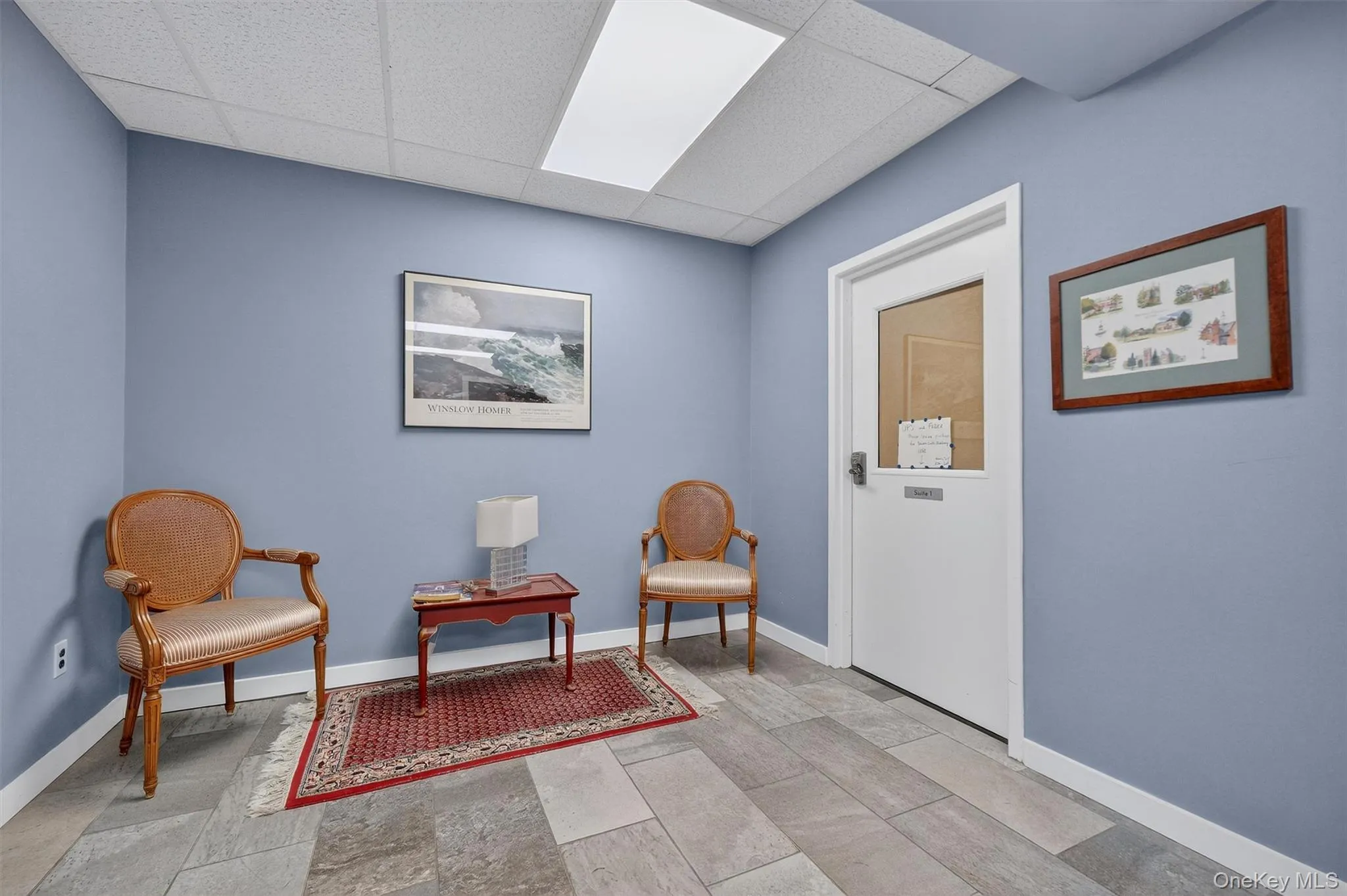 Sitting room with a paneled ceiling Sitting room with a paneled ceiling