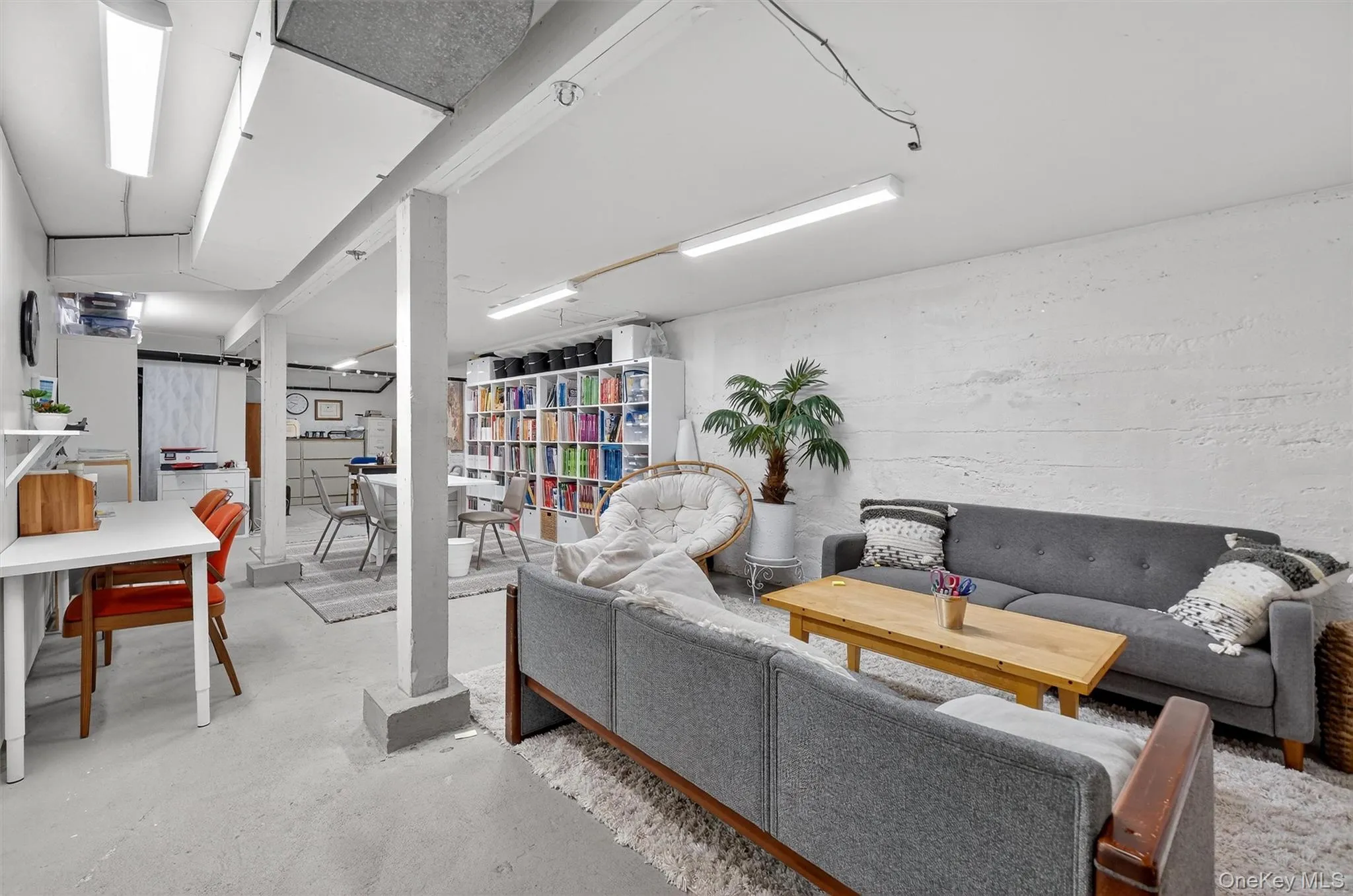 Living area with concrete flooring and a heating unit Living area with concrete flooring and a heating unit
