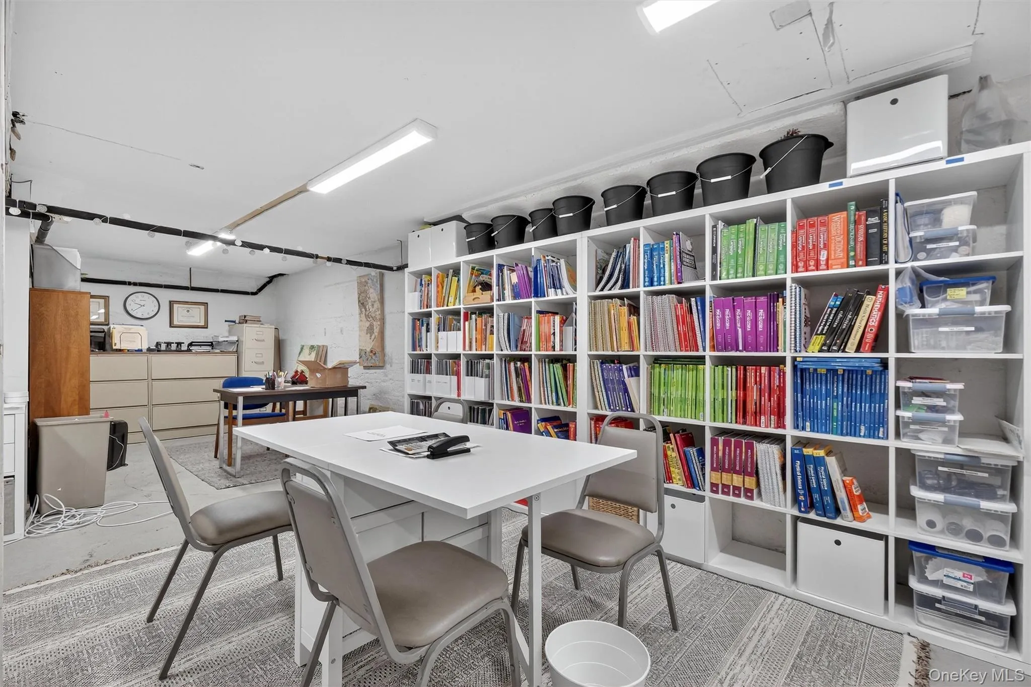 Office area featuring concrete floors Office area featuring concrete floors